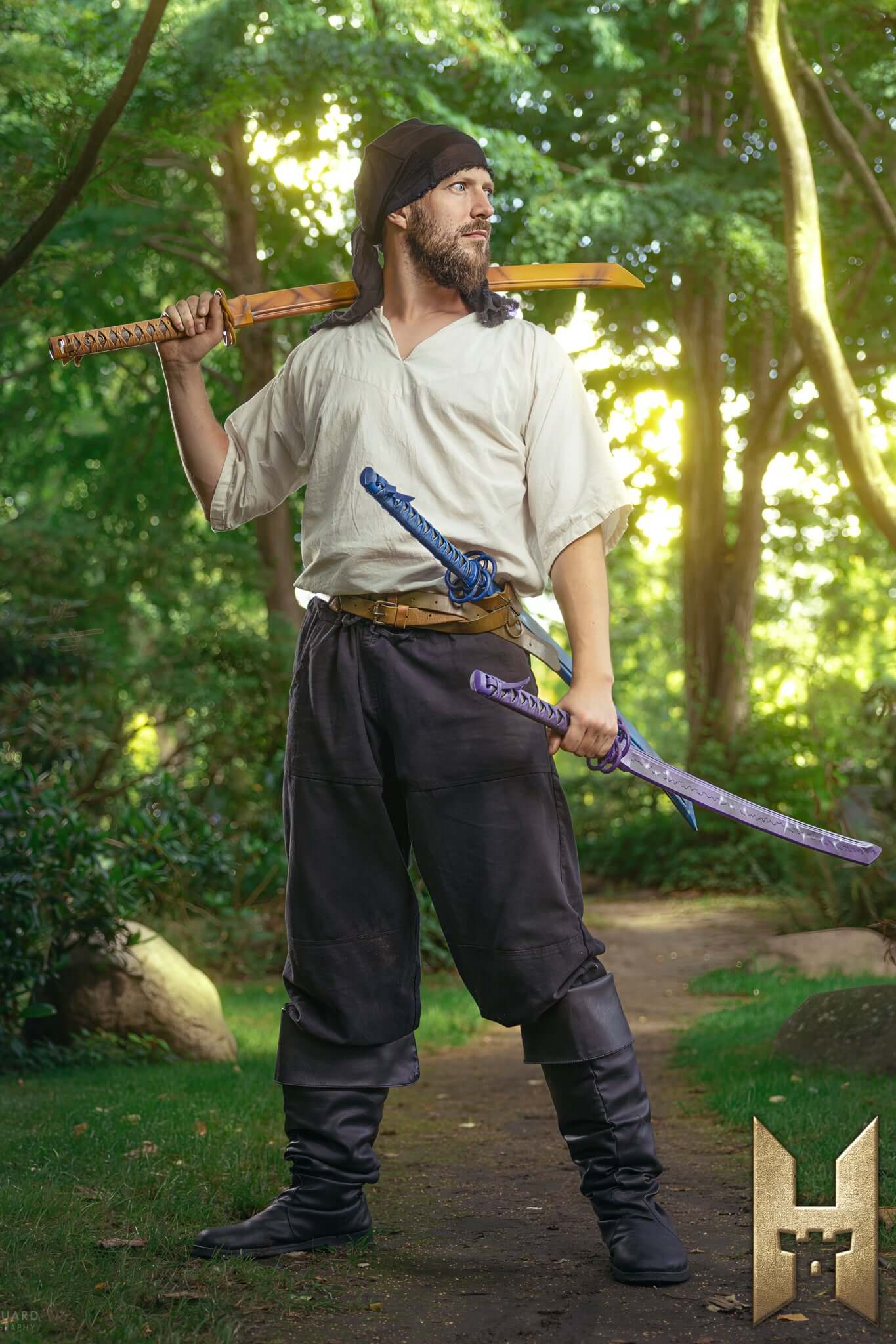 Ryūgan the Katana held by a figure in a natural setting, showcasing its elegance and design.