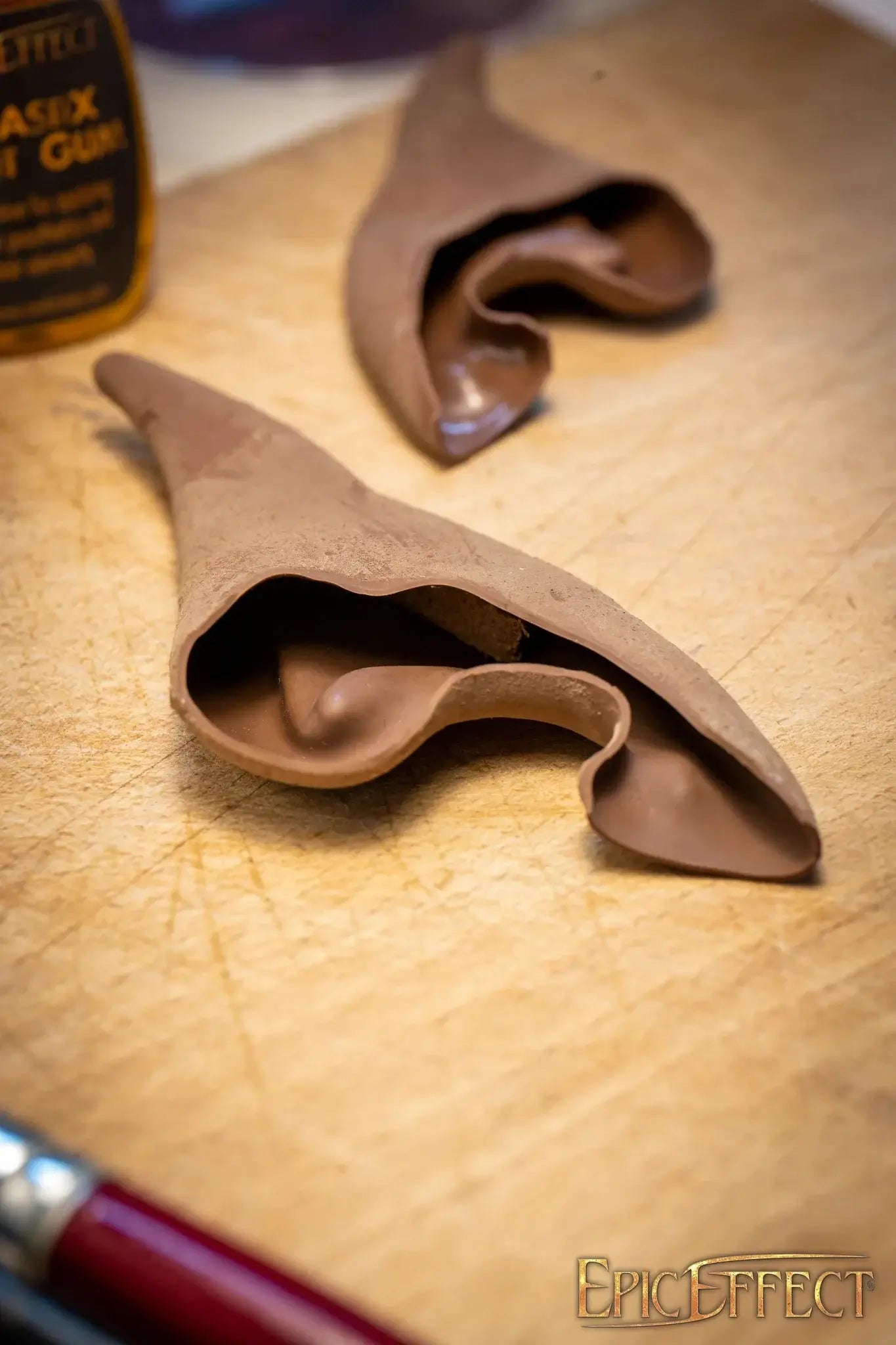 Elven Ears Long props created from latex on a wooden surface, perfect for fantasy costumes.