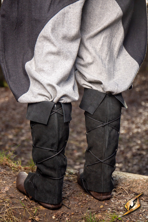 Theoderic gaiters worn by a person standing on the ground, showcasing their unique design and sturdy material.