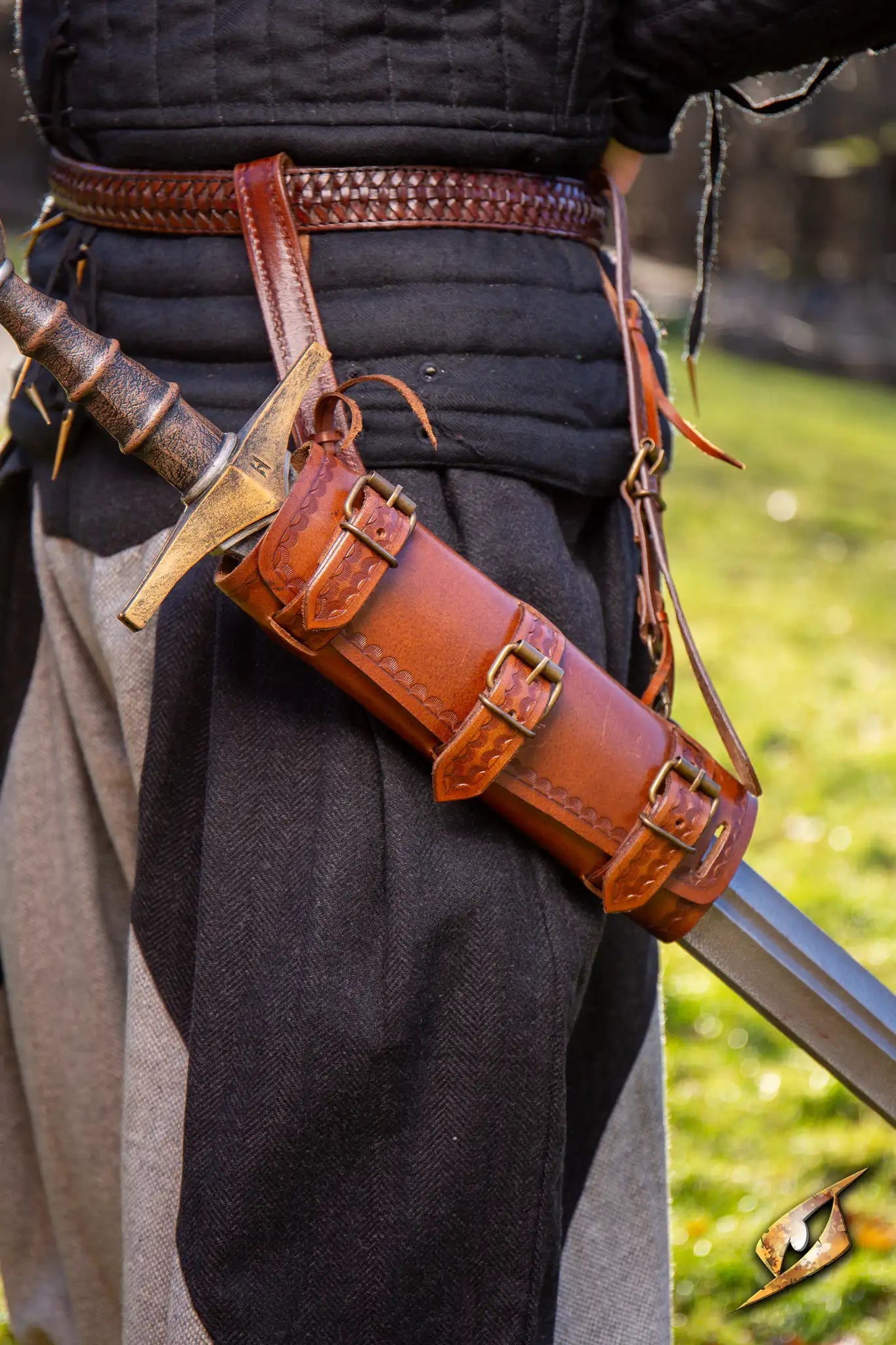 Adjustable Scabbard shown attached to a sword on a character's side in a historical setting.