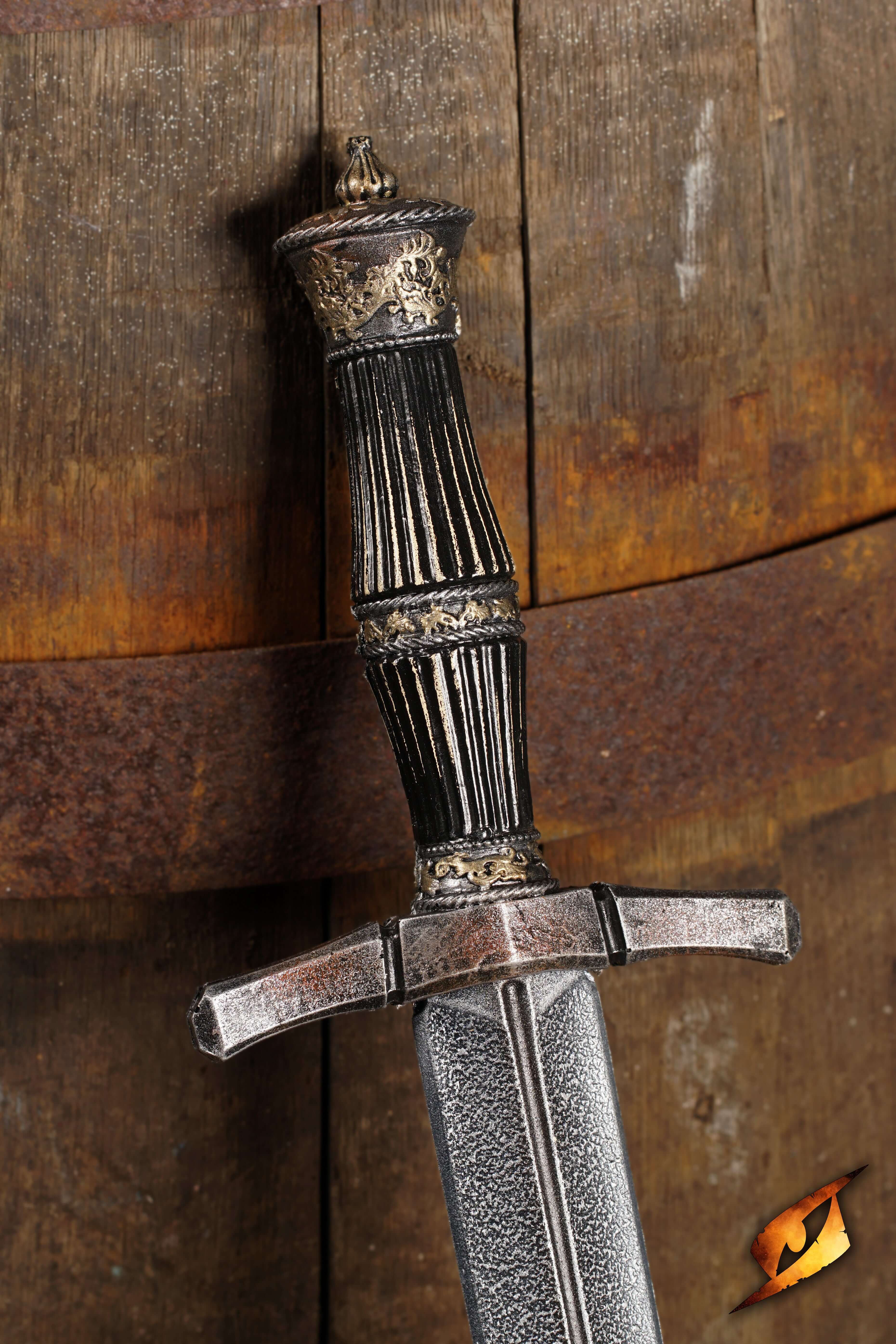 Blocking Dagger with ornate hilt displayed against a wooden barrel background, emphasizing its design and craftsmanship.
