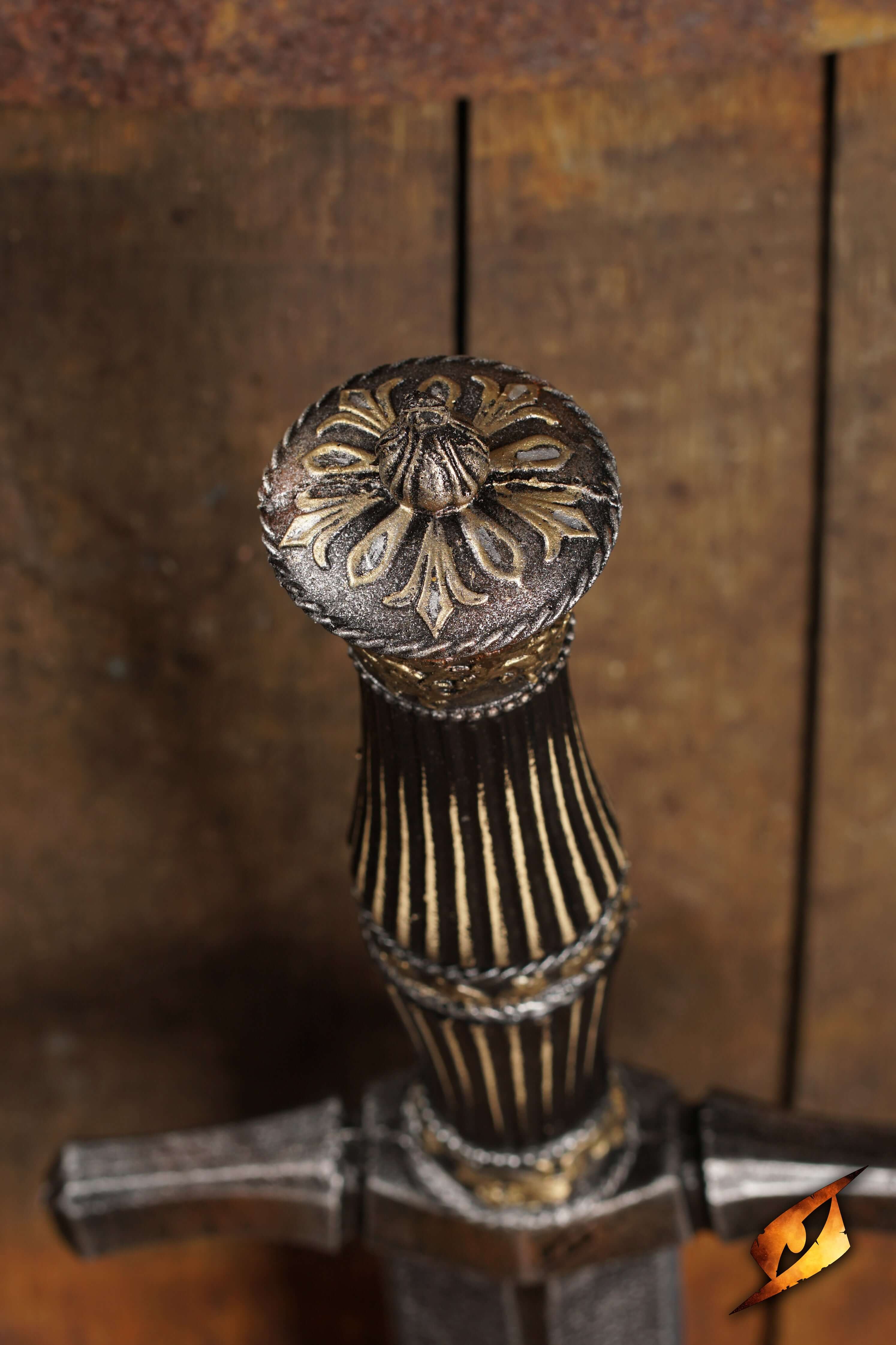 Close-up view of the intricately designed handle of a Blocking Dagger, showcasing ornate details and craftsmanship.