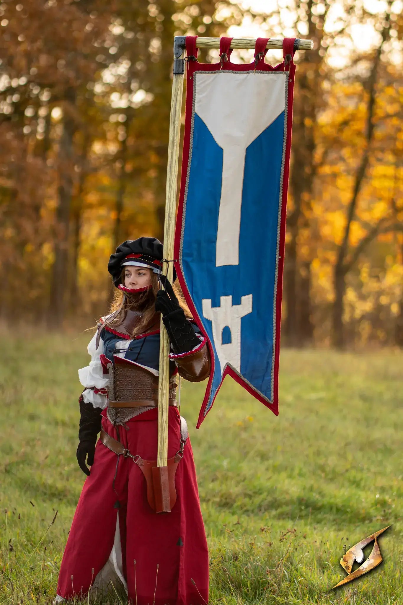 Battle Standard - L-Top held by a person in a medieval outfit, displaying a colorful banner in a natural setting.
