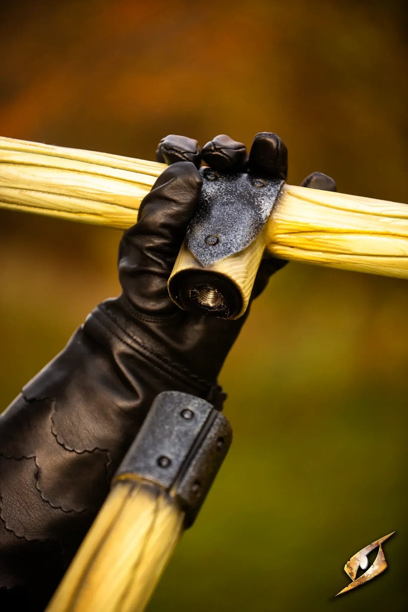 Close-up of a hand gripping the Battle Standard - T-Top with a bolt system for secure attachment.