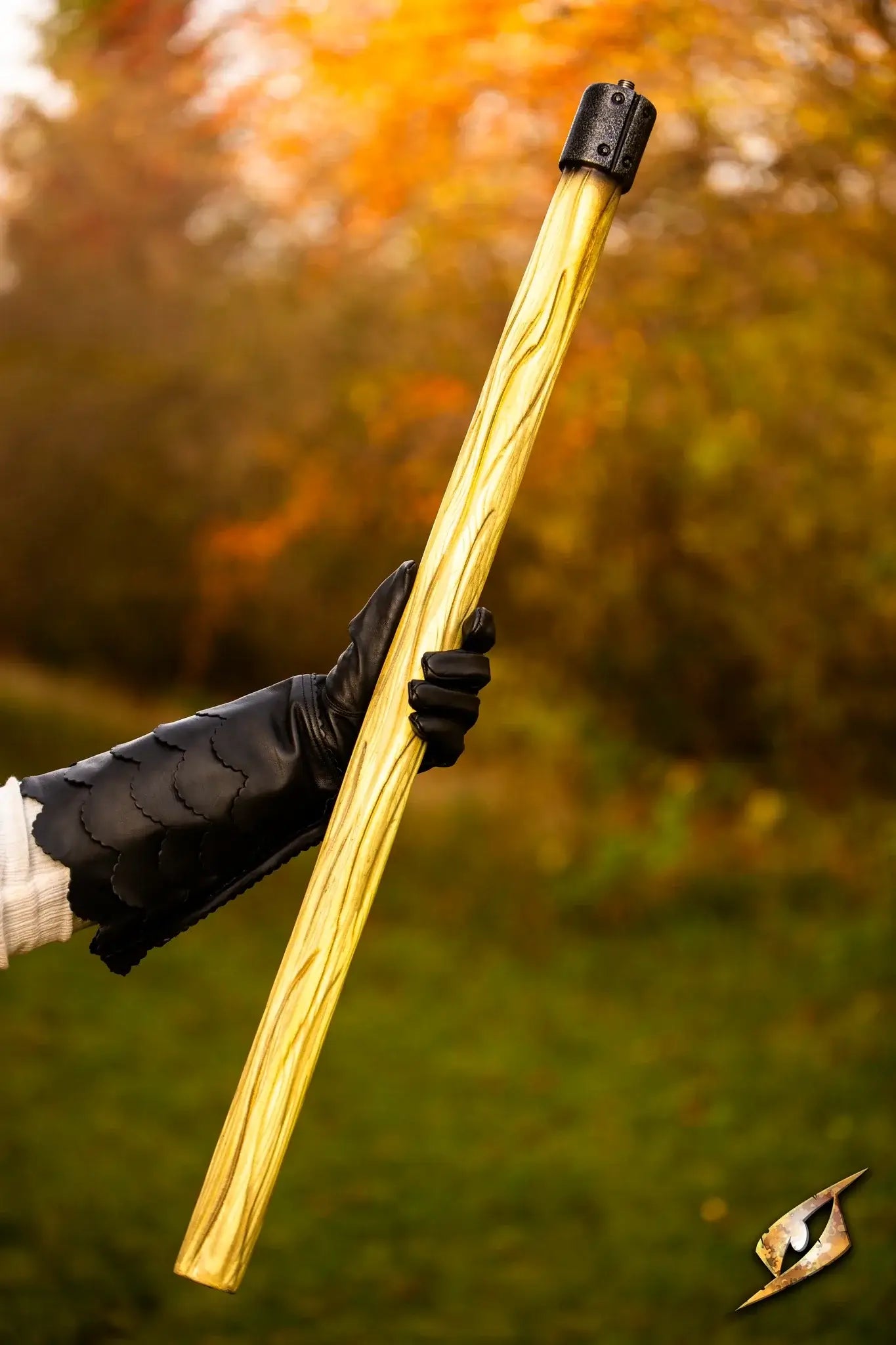 Battle Standard - Short Pole held outdoors with vibrant autumn background, showcasing its lightweight and durable design.