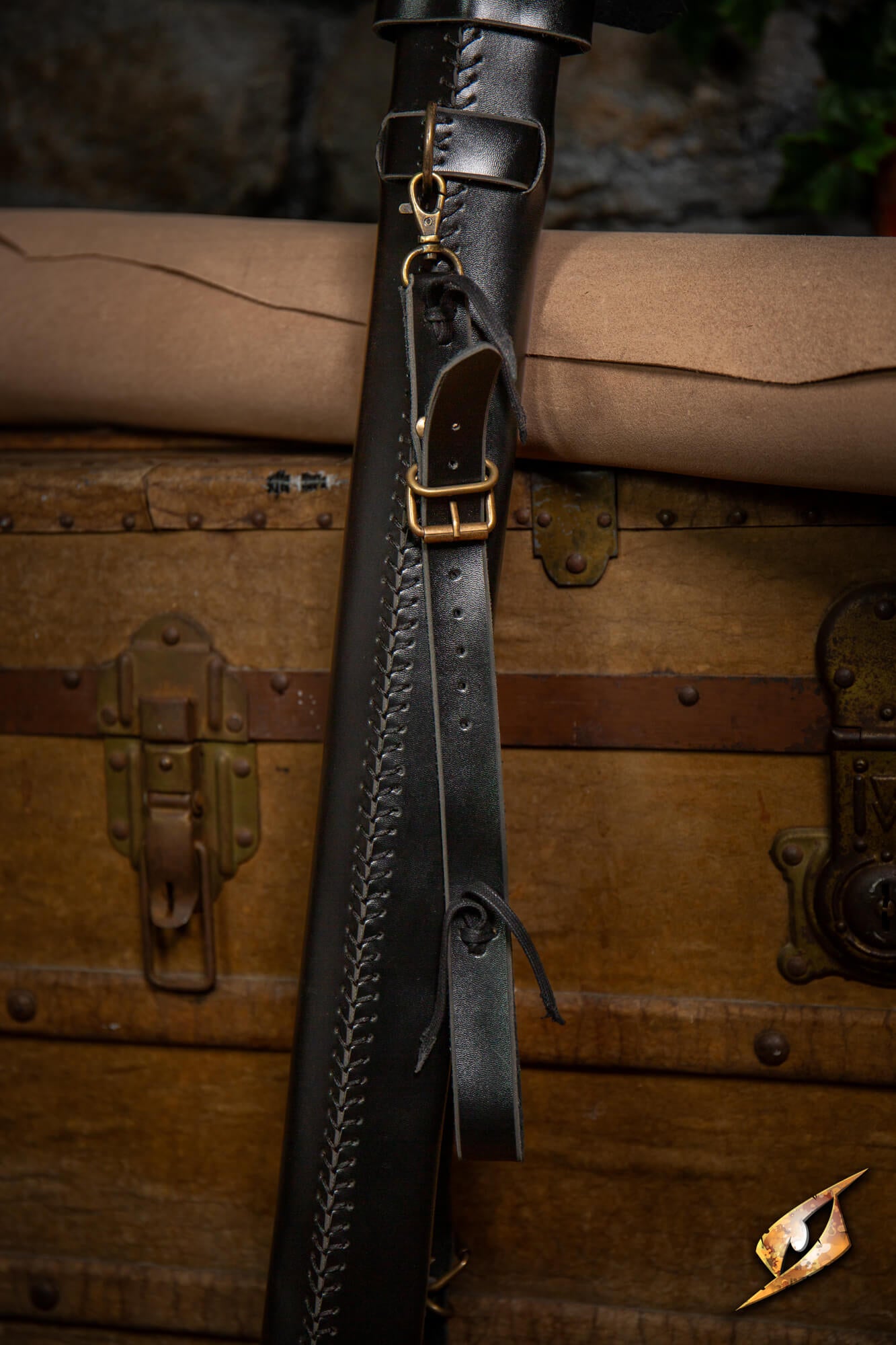 Adjustable Scabbard - Faux Leather with adjustable straps and buckles on a wooden background.