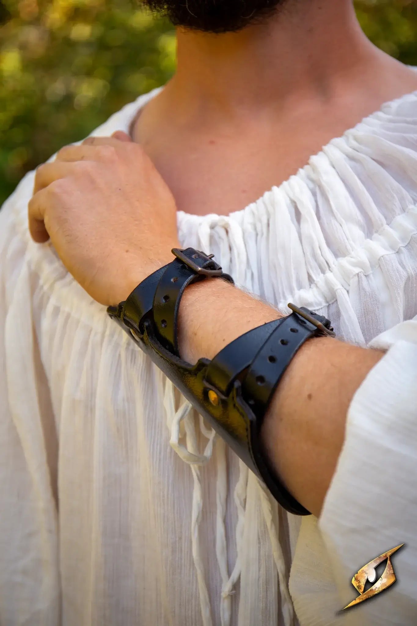 Archery Bracer worn by a person in a white shirt, showcasing its detailed leather design.