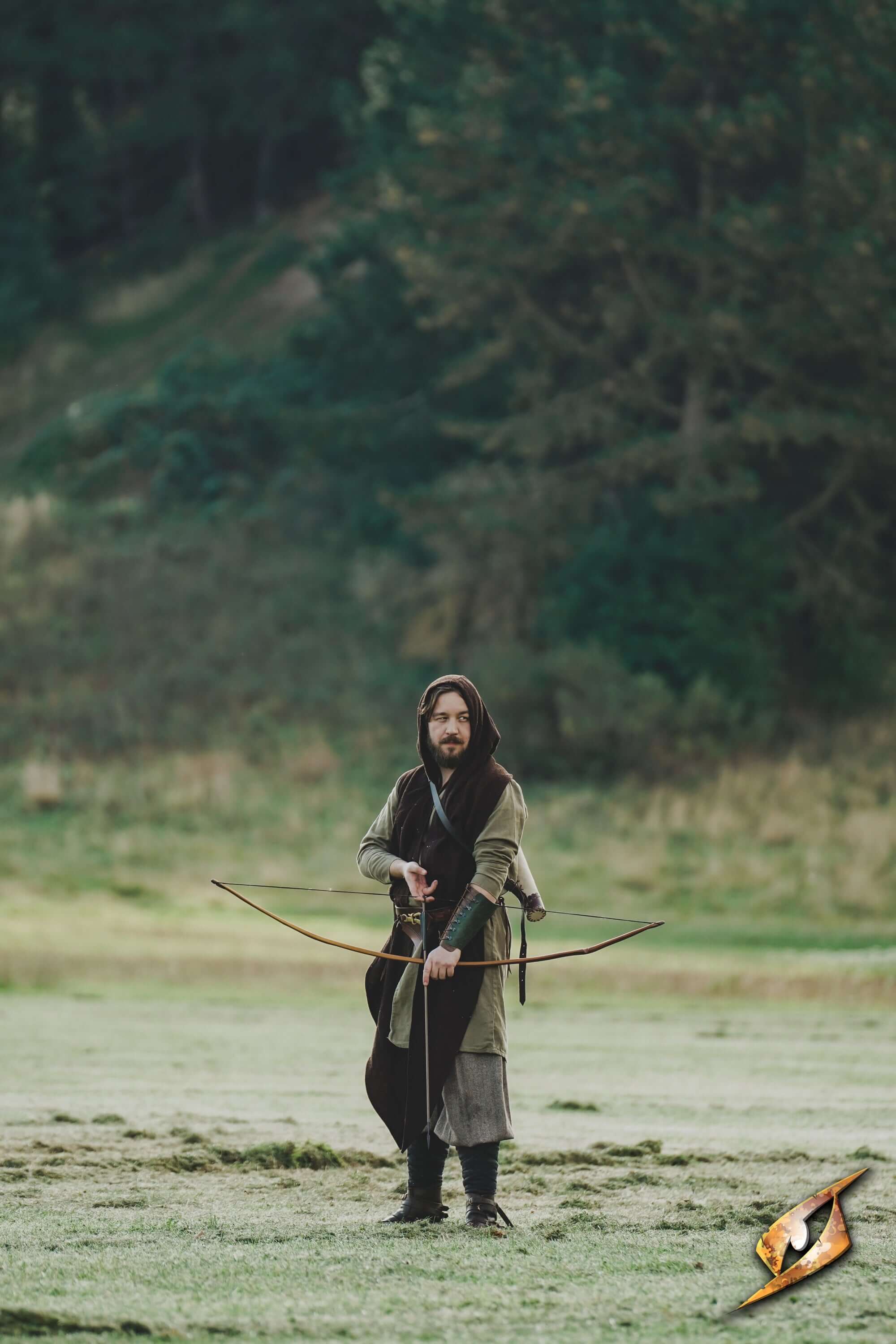 Glade Warden Bracer worn by archer in forest setting, showcasing craftsmanship and style.
