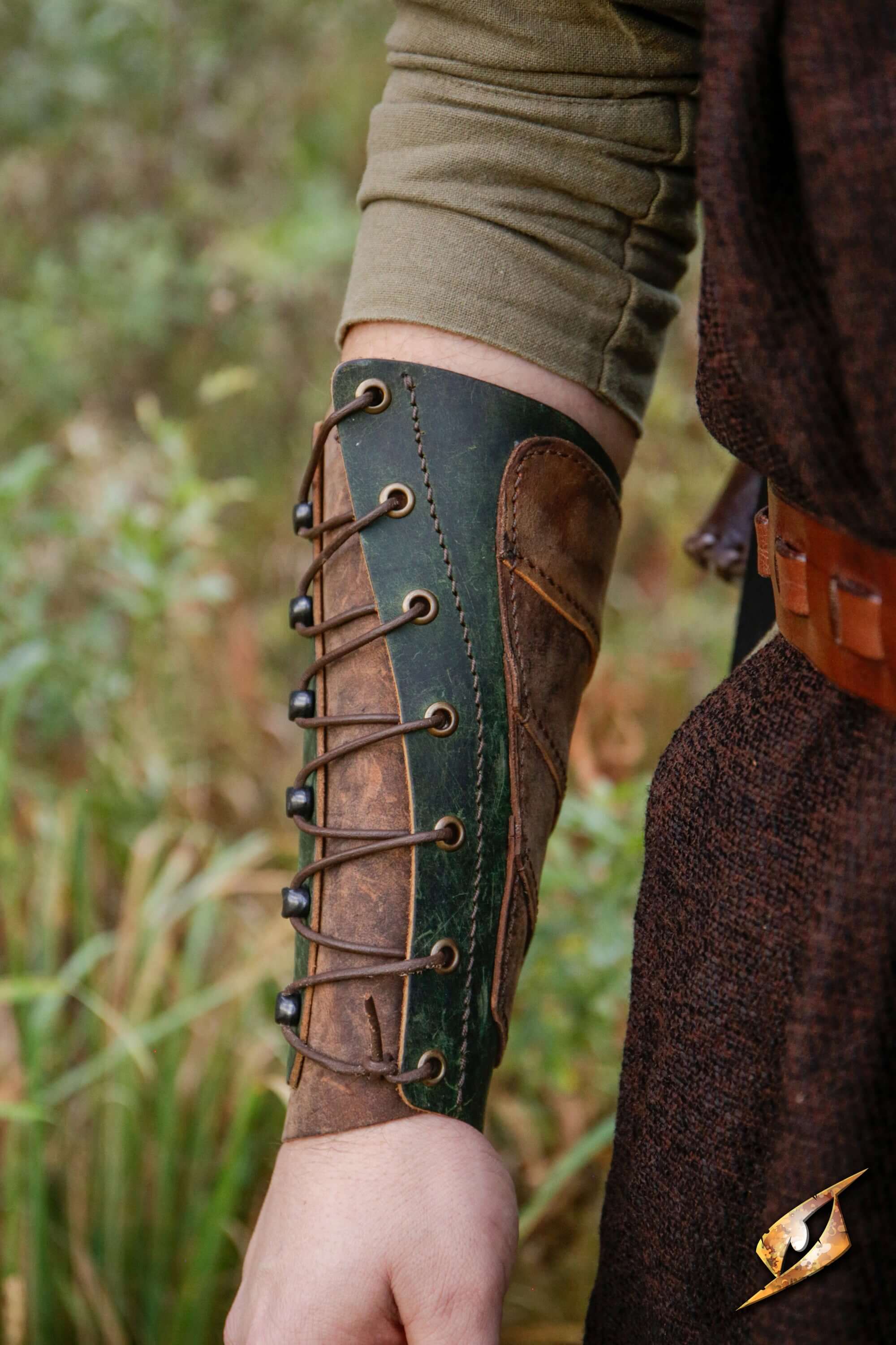 Glade Warden Bracer shown on a forearm, handmade leather design for archery and outdoor activities.