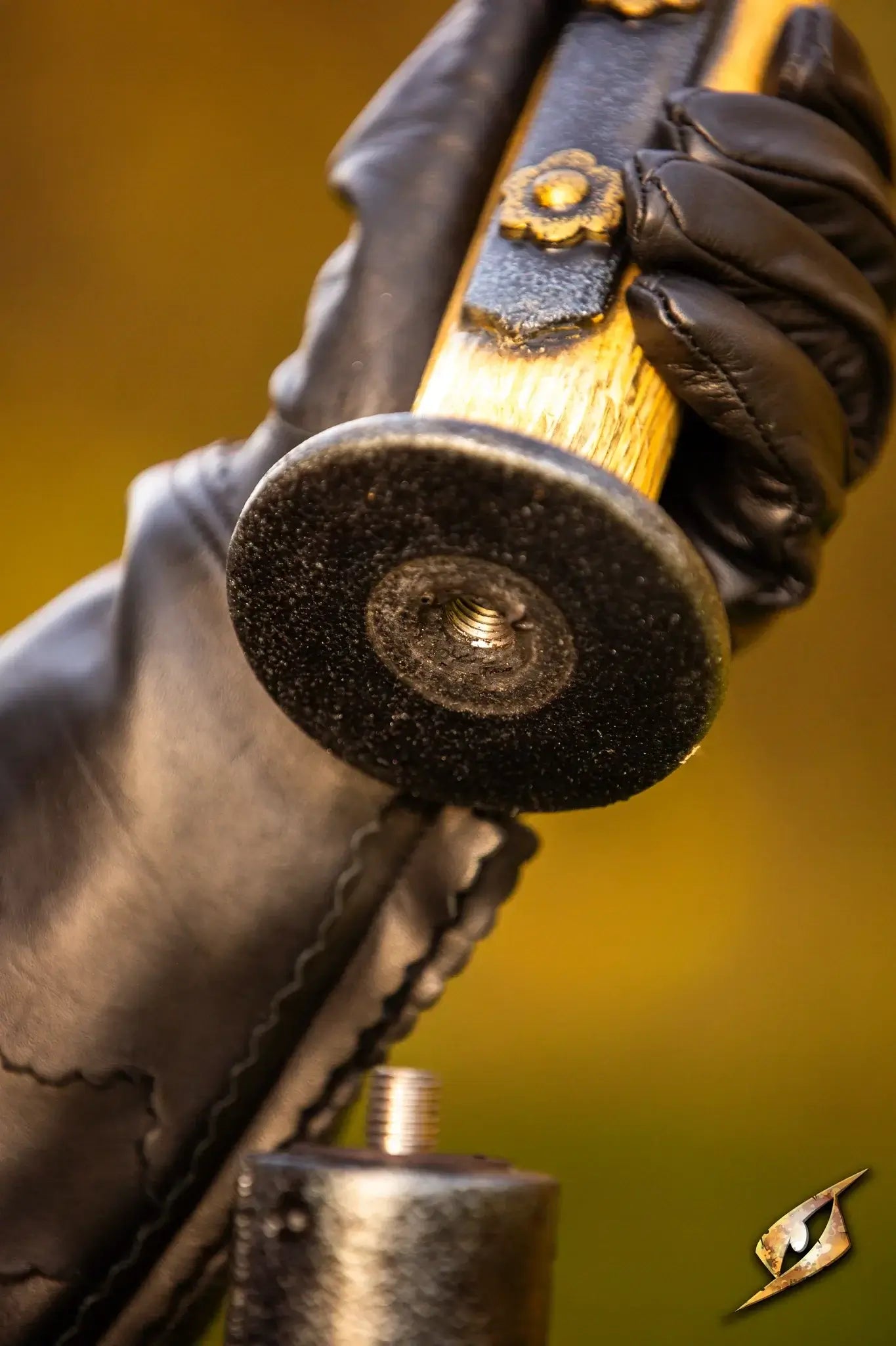 Close-up of a hand gripping the handle of the Battle Standard - Halberd Top, showcasing detailed craftsmanship.