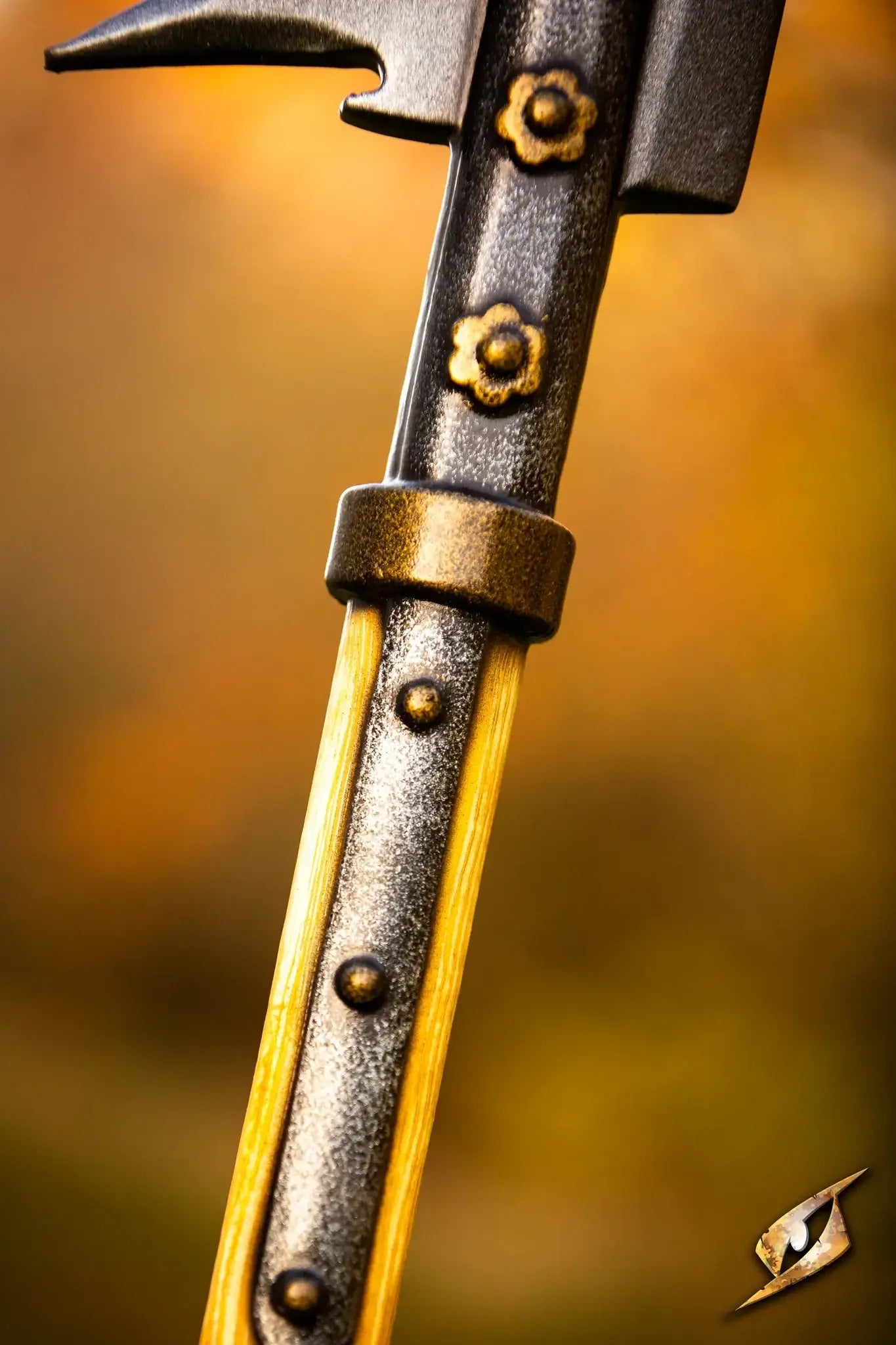 Close-up of the decorative handle of the Battle Standard - Fauchard Top with floral accents and detailed craftsmanship.