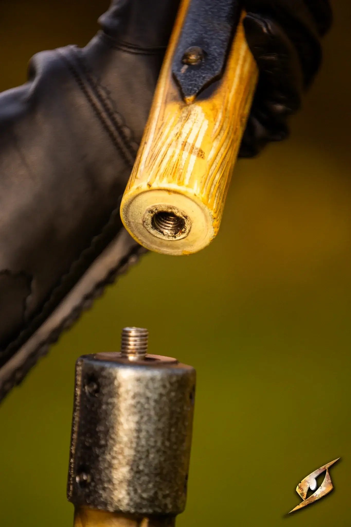 Close-up of the bolt system of the Battle Standard - Fauchard Top being attached for a tactical setup.