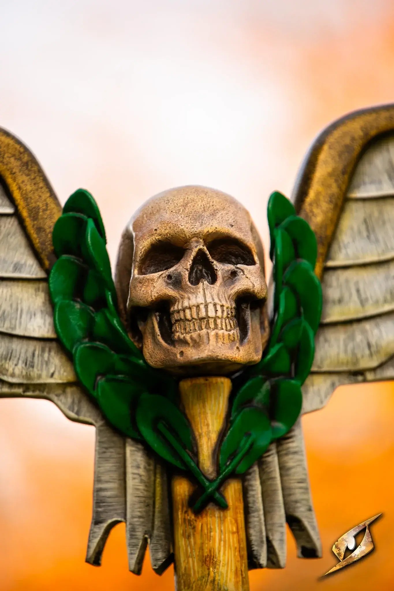 Battle Standard - Winged Skull Top featuring a skull with wings and green accents, depicting a fierce battle aesthetic.