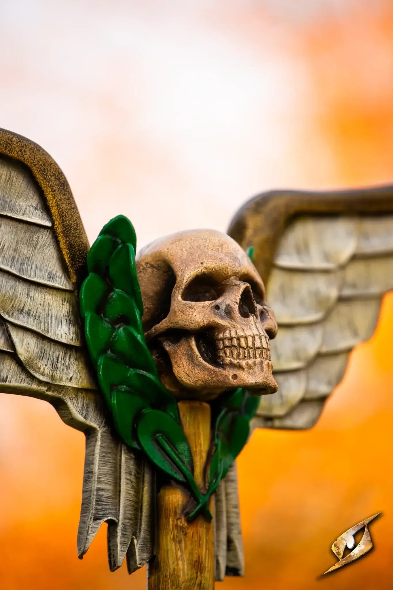 Battle Standard - Winged Skull Top featuring a detailed skull with wings and decorative elements.
