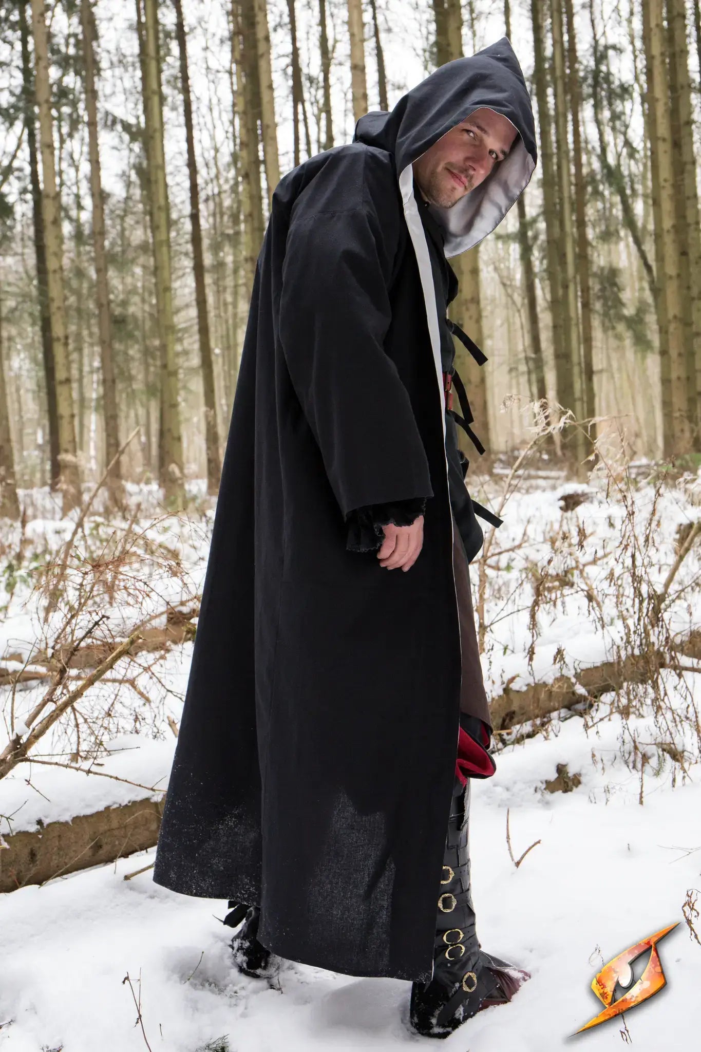 A mage wearing a Magician Robe stands confidently in a snowy forest, ready to cast spells.