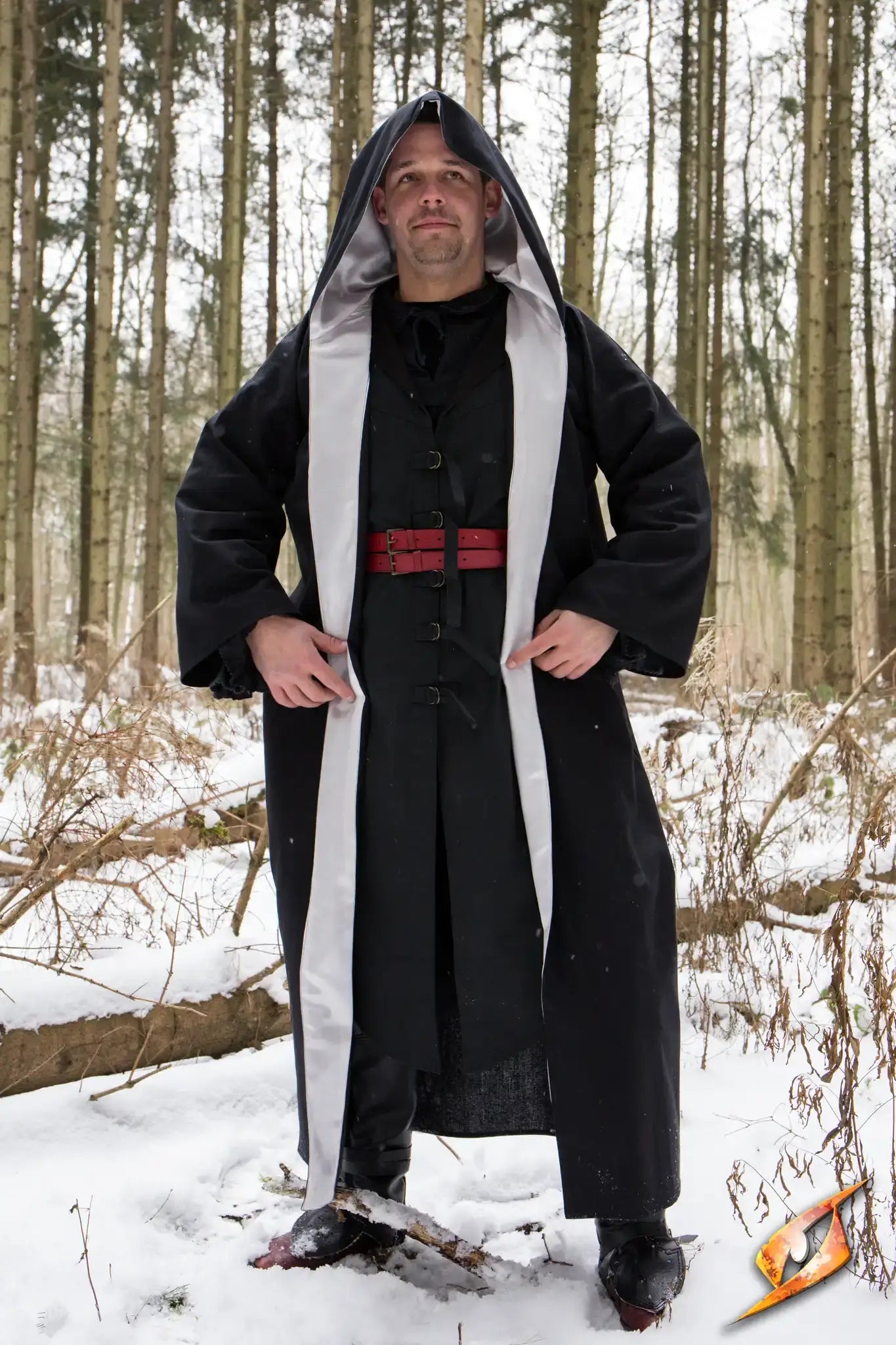 A person wearing a Magician Robe stands in a snowy forest, showcasing the mystical style of the attire.