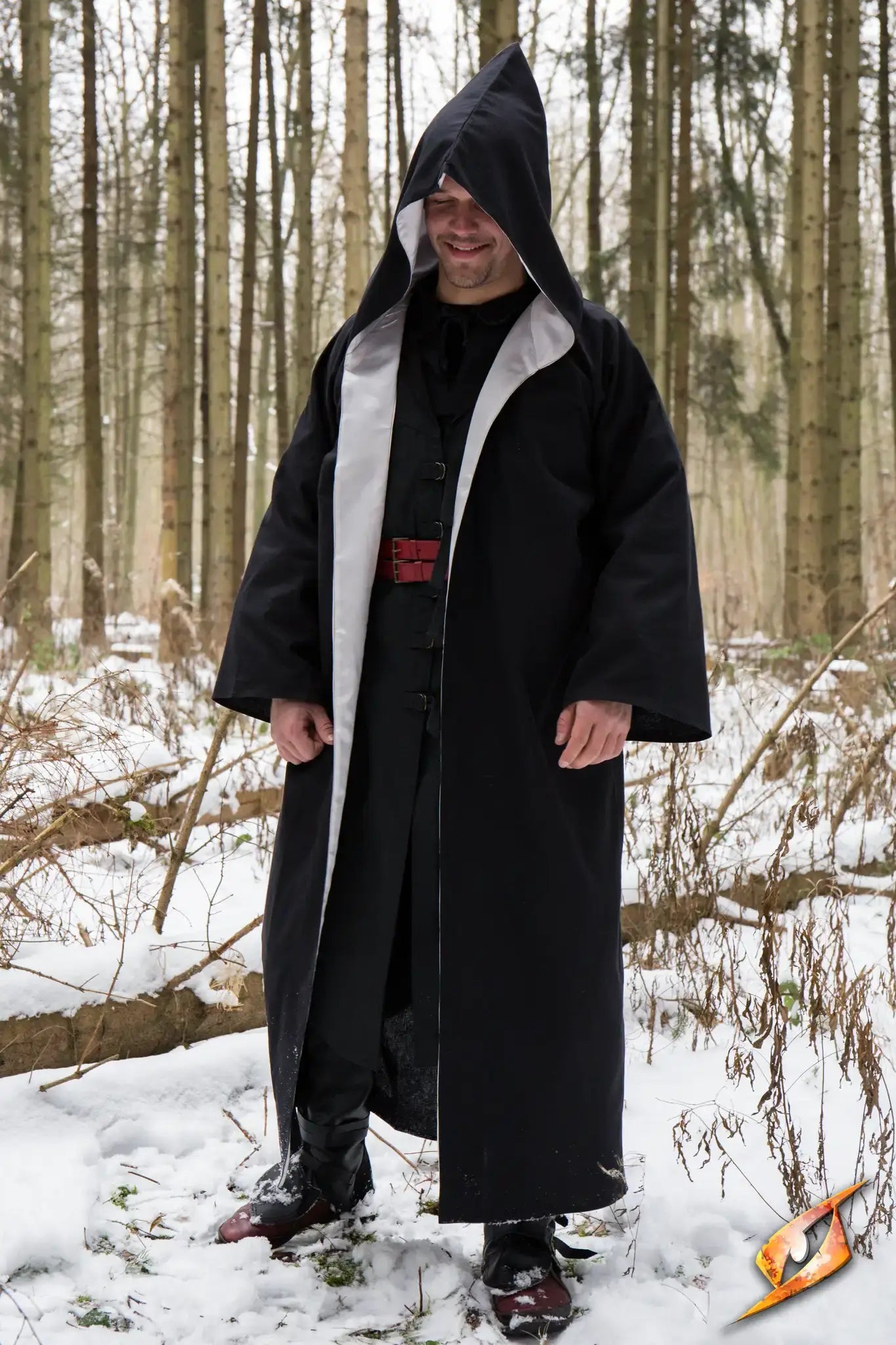 Magician Robe displayed in a snowy forest, showcasing its flowing design and mystical appearance.