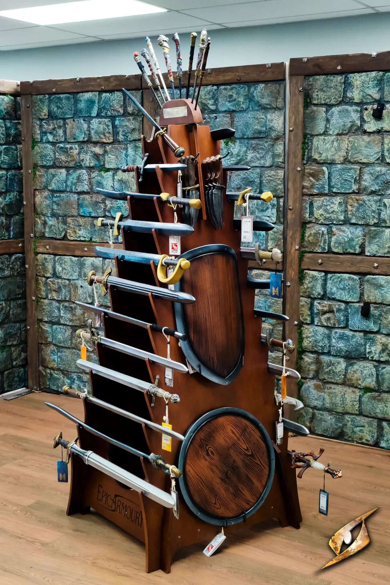 Weapons Rack displaying various swords and shields in a medieval-themed room.