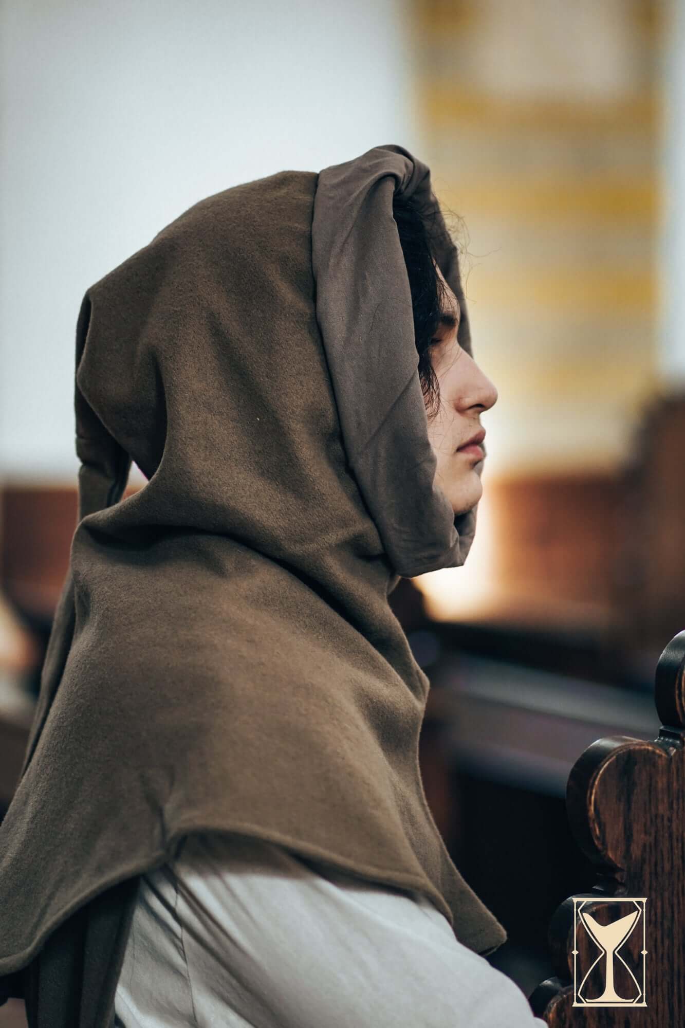 Simple Liripipe Hood - Brushed Wool worn by a person, showcasing its medieval style and practicality.