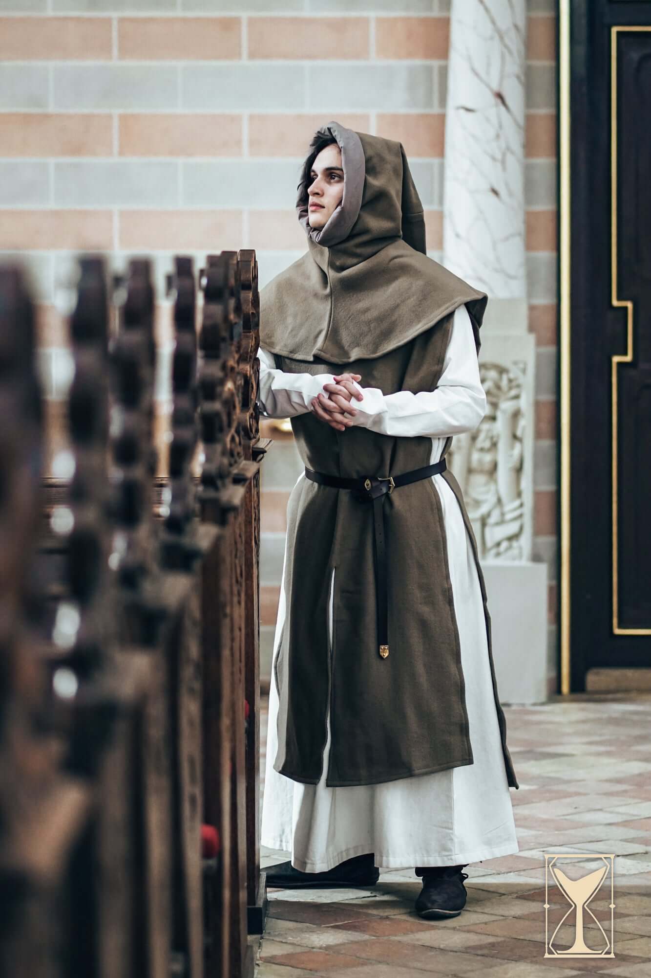Simple Liripipe Hood - Brushed Wool worn by a model in a medieval setting.