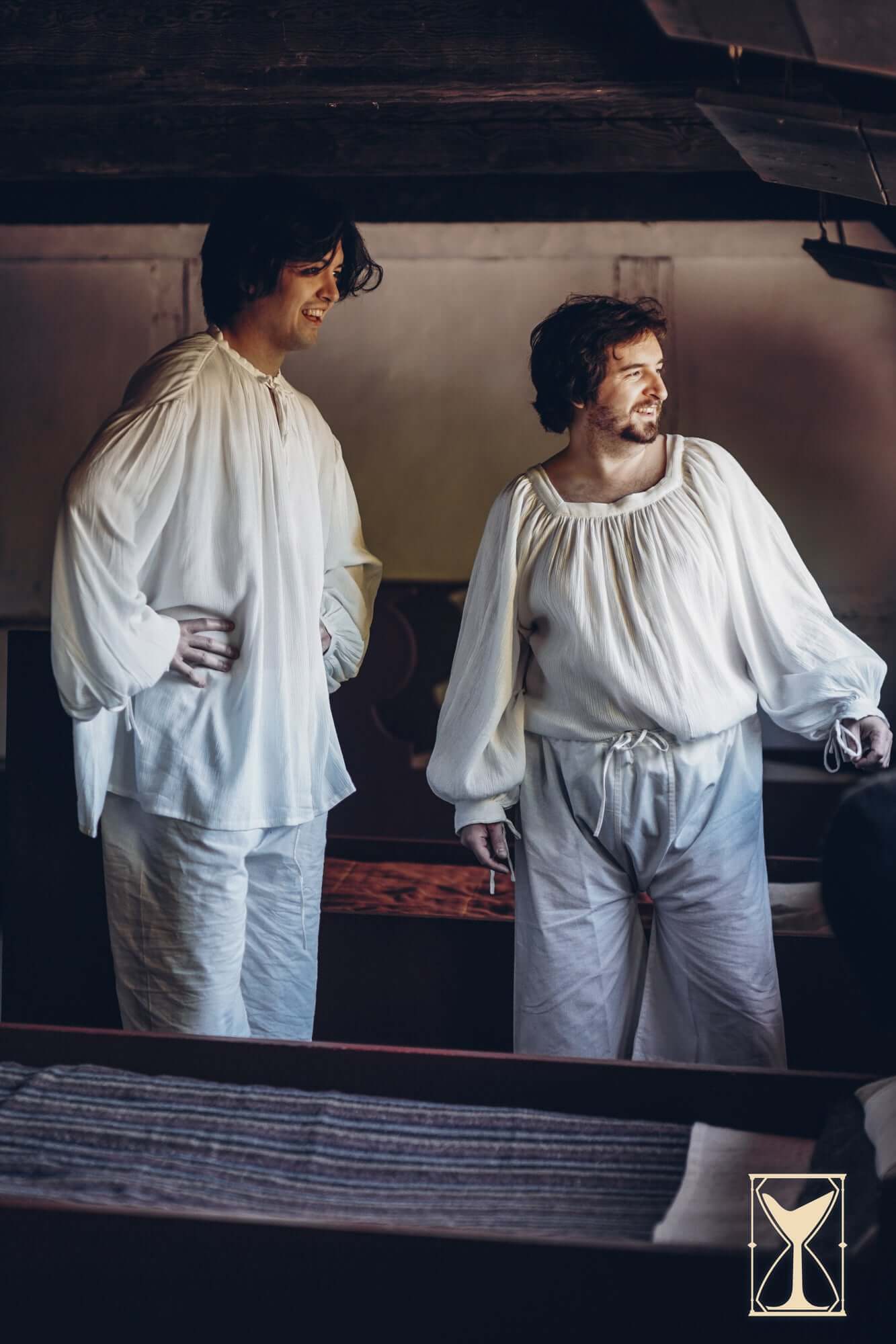 Two men wearing medieval shirts, showcasing the Shirt Duccio style, perfect for historical reenactments.