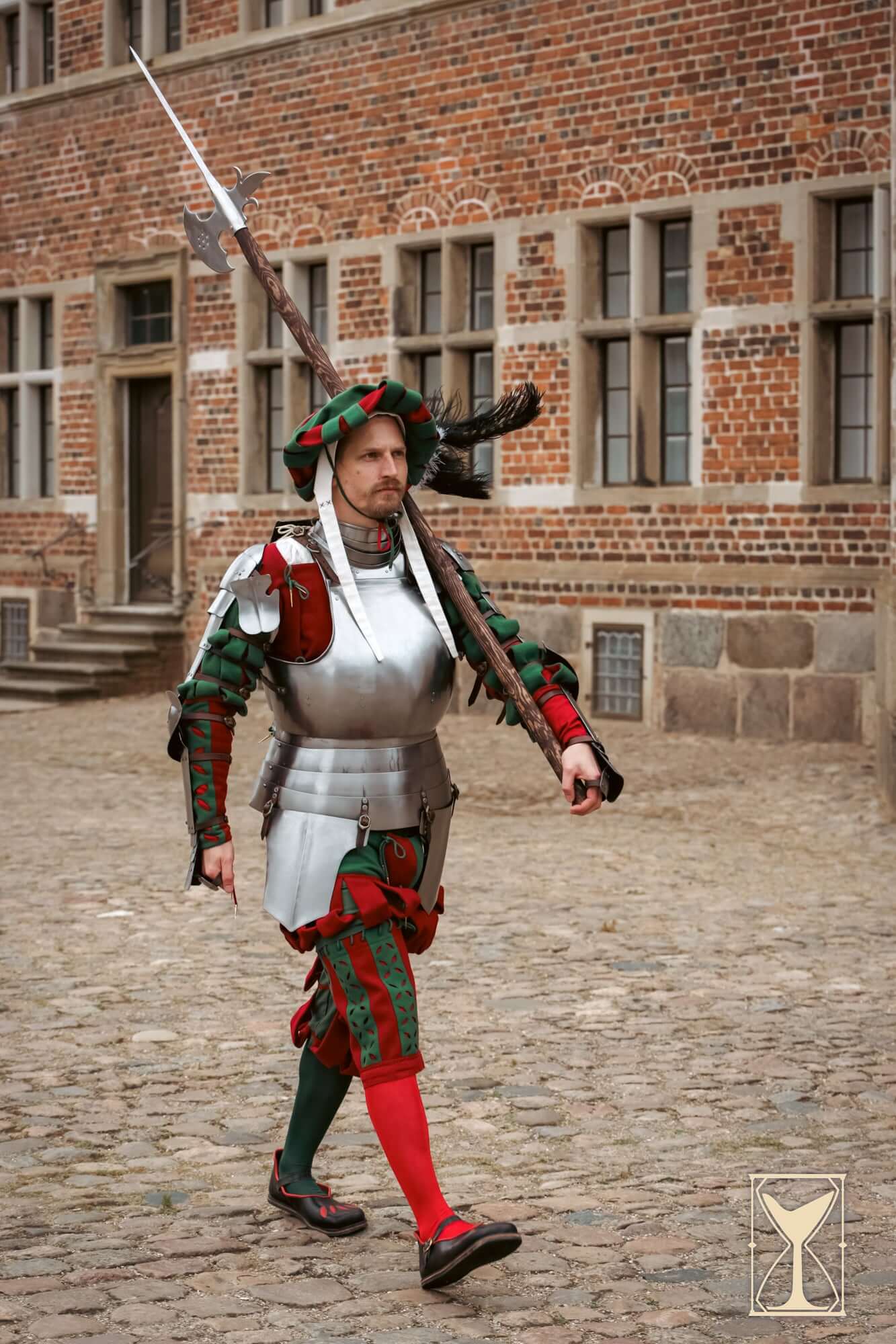Landsknecht Cuirass - 1.6mm - Yoremade worn by a soldier in traditional 16th-century attire on cobbled street.