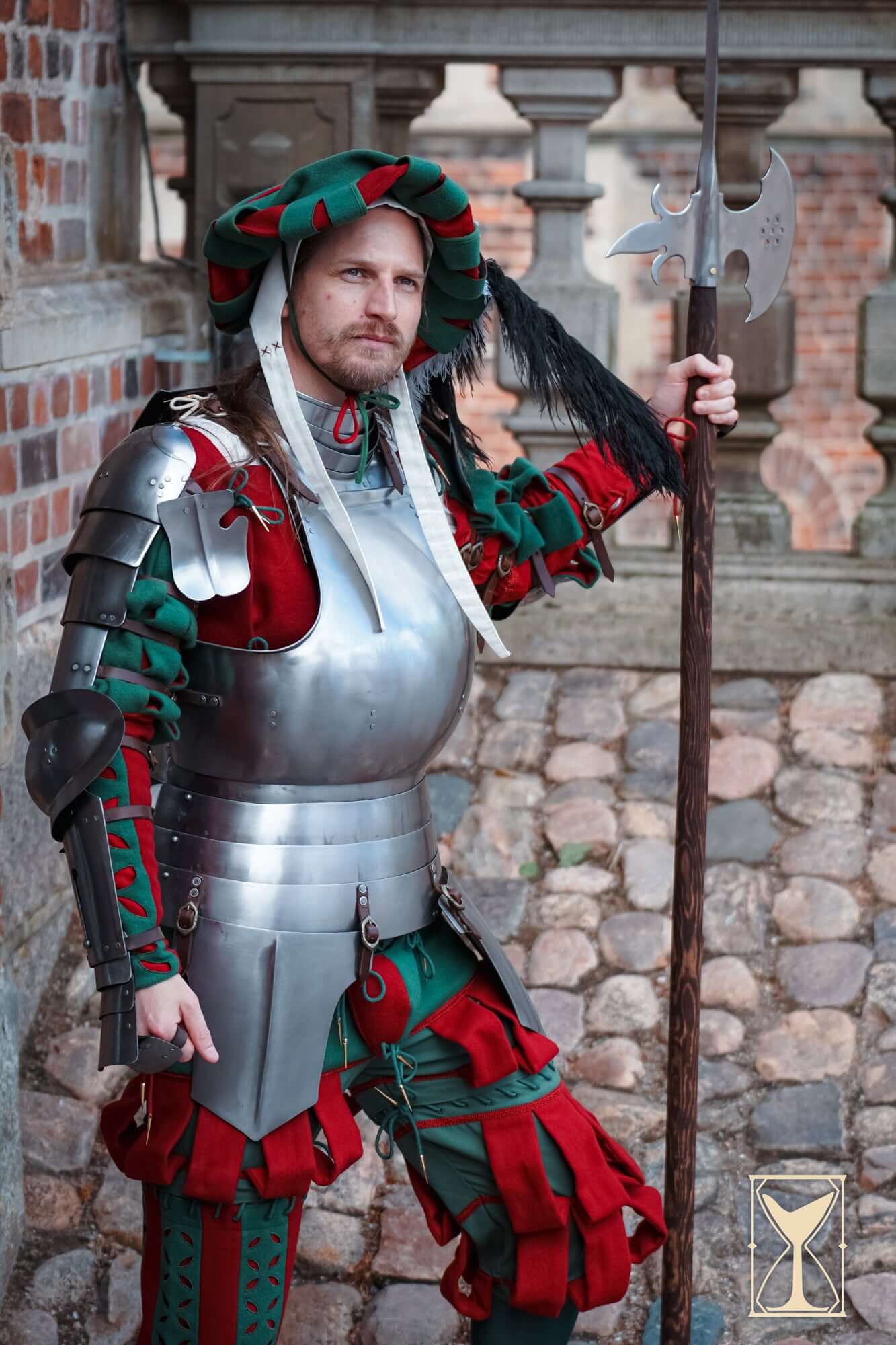 Landsknecht Cuirass - 1.6mm - Yoremade worn by a soldier in colorful period attire with an axe and spear.