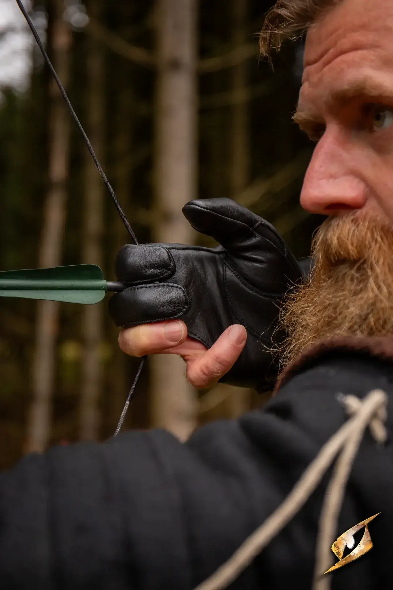 Archer wearing an Archery Half-glove, focusing on aim with precise grip and comfort in a wooded setting.
