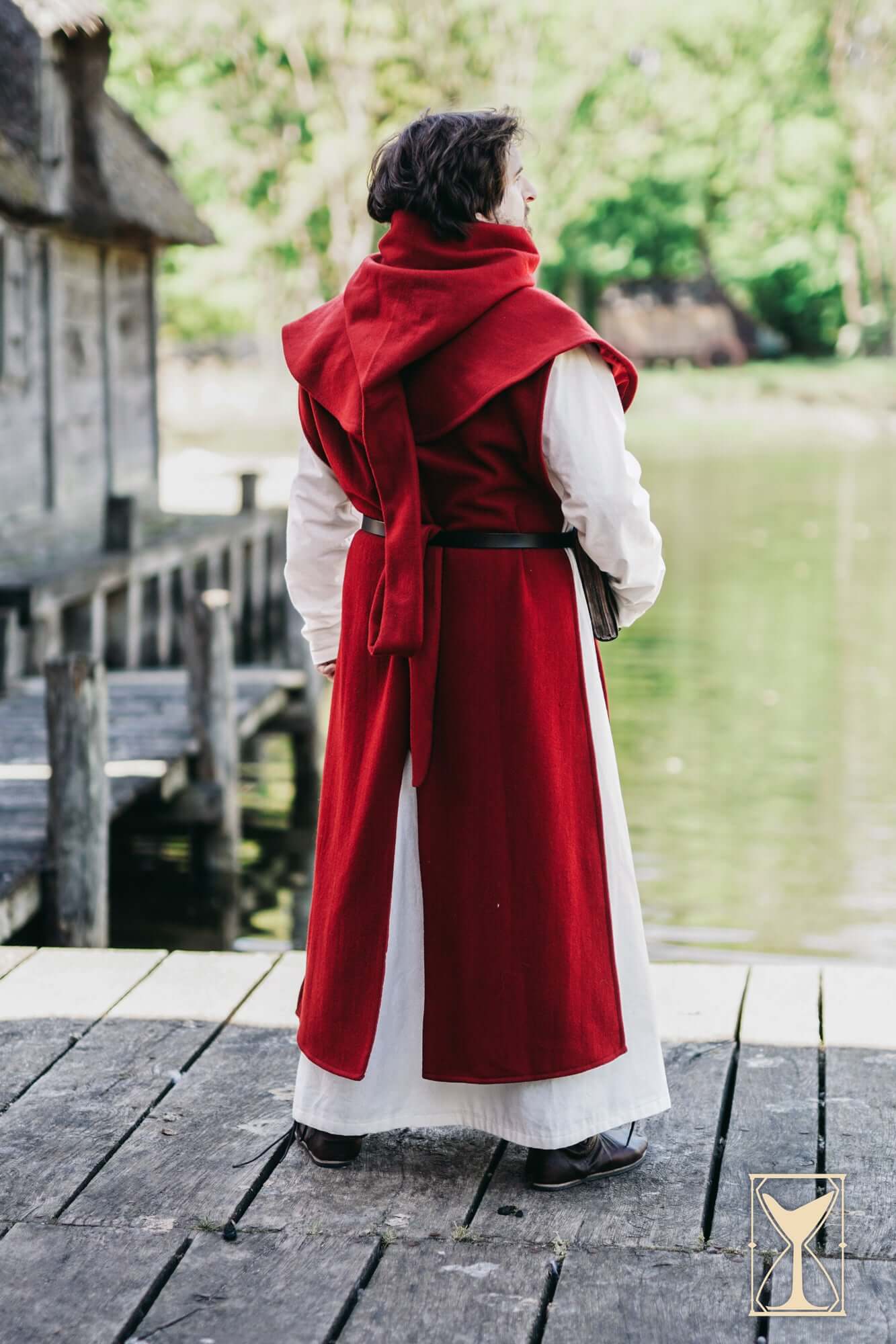Cyclas Bernard worn by a person near water, showcasing its layered medieval design and realism.