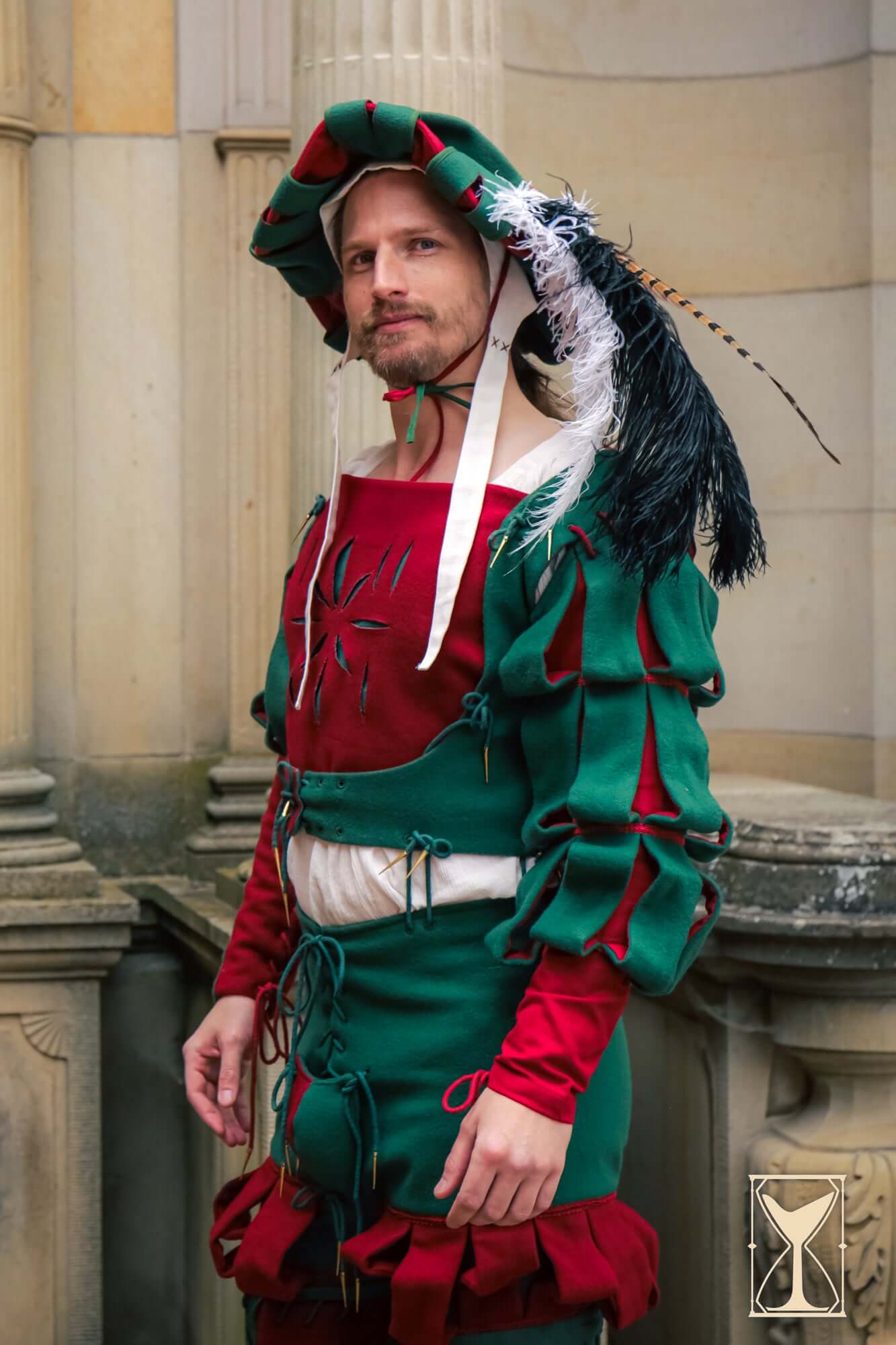 Landsknecht Waterfall Sleeve worn by a man in historical costume, showcasing vibrant colors and intricate details.