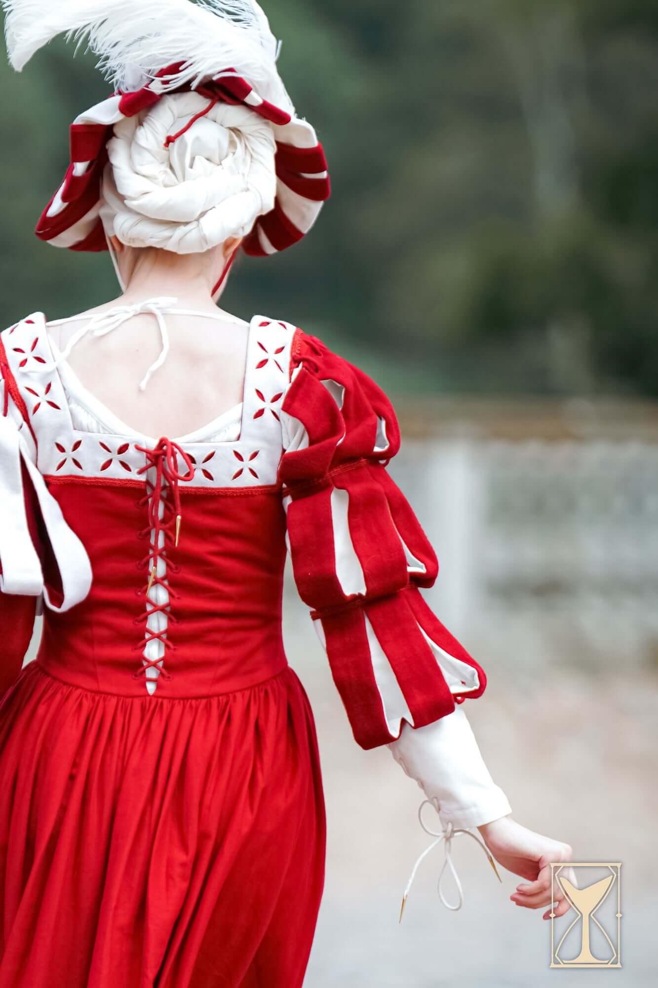 Landsknecht Waterfall Sleeve displayed on a model in red historical attire, showcasing 16th-century fashion.