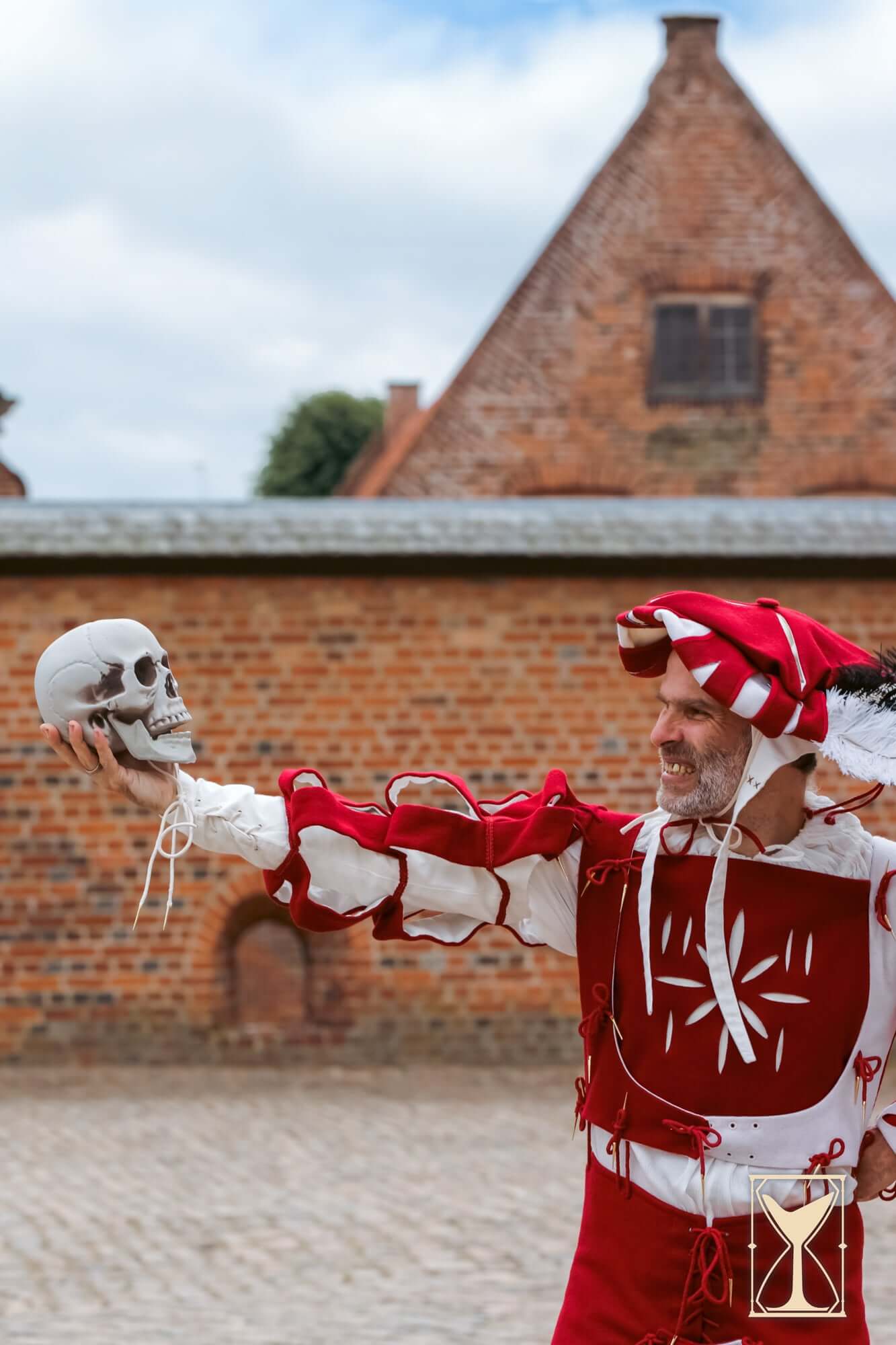 Landsknecht Waterfall Sleeve worn by performer holding skull in historical costume.