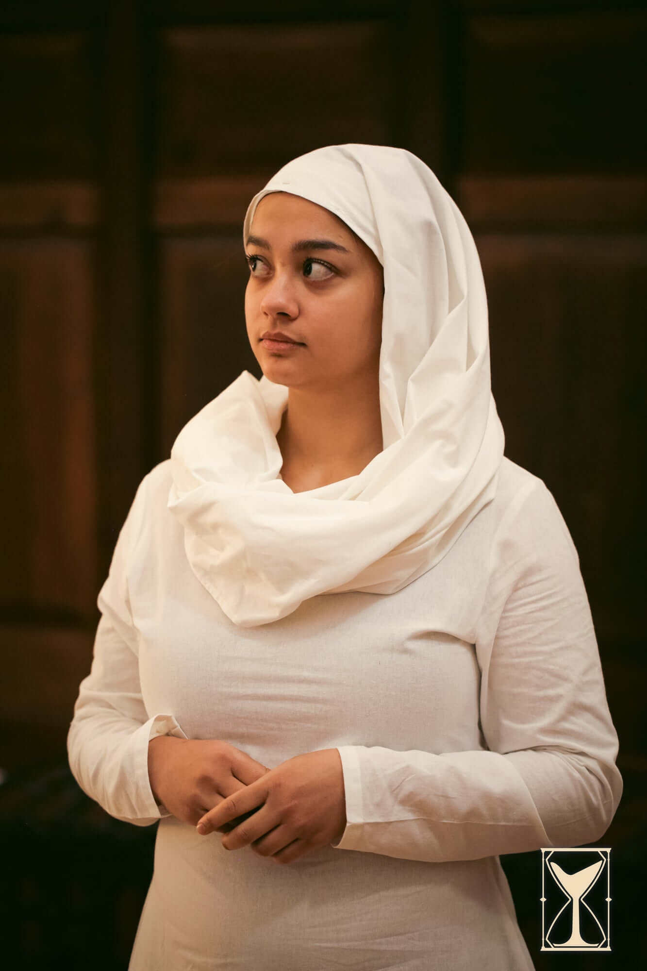 Woman wearing a white Chemise and headscarf, showcasing medieval attire from the Yoremade collection.
