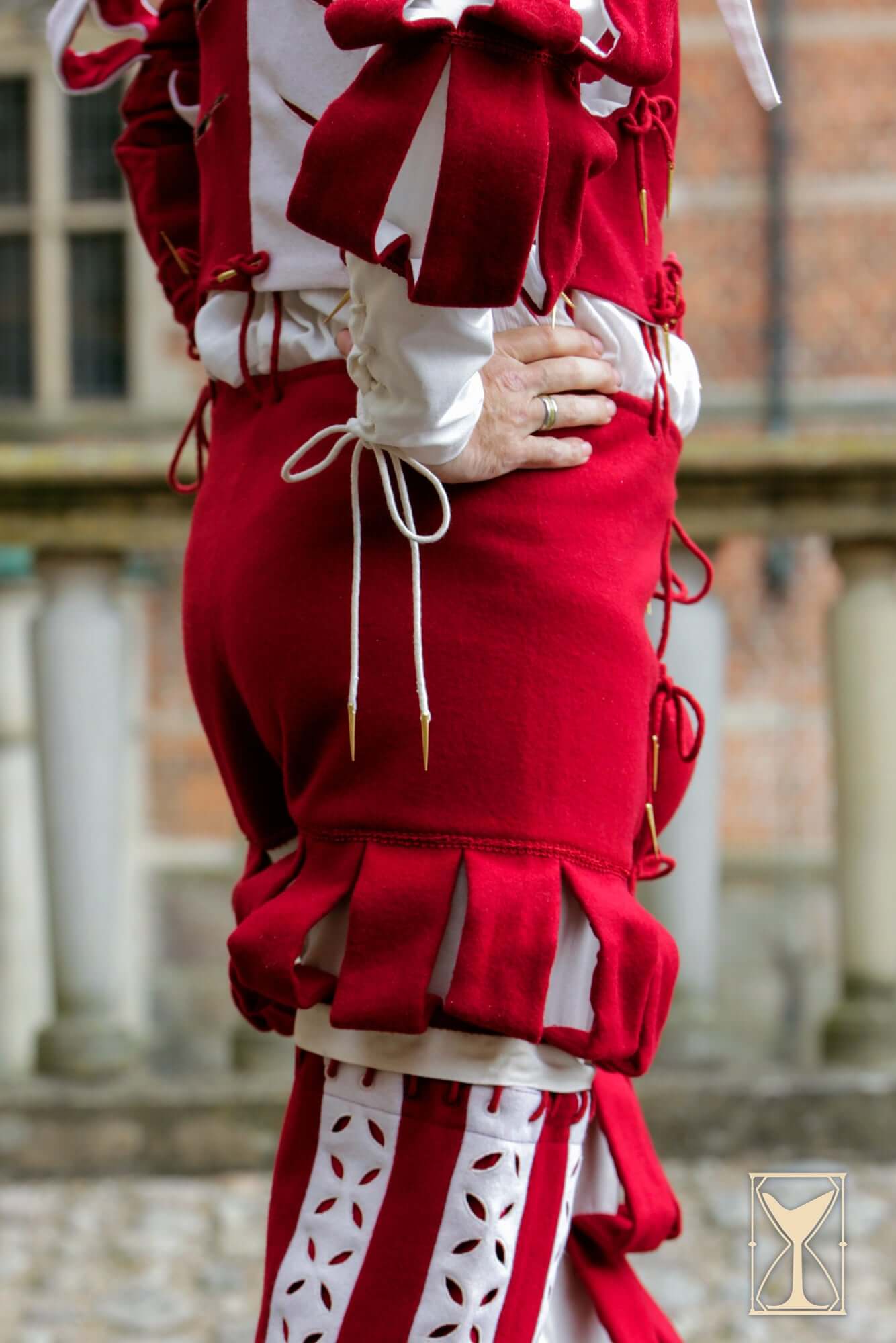 Landsknecht Breeches in bold red with decorative slashes, showcasing 16th-century mercenary fashion details.