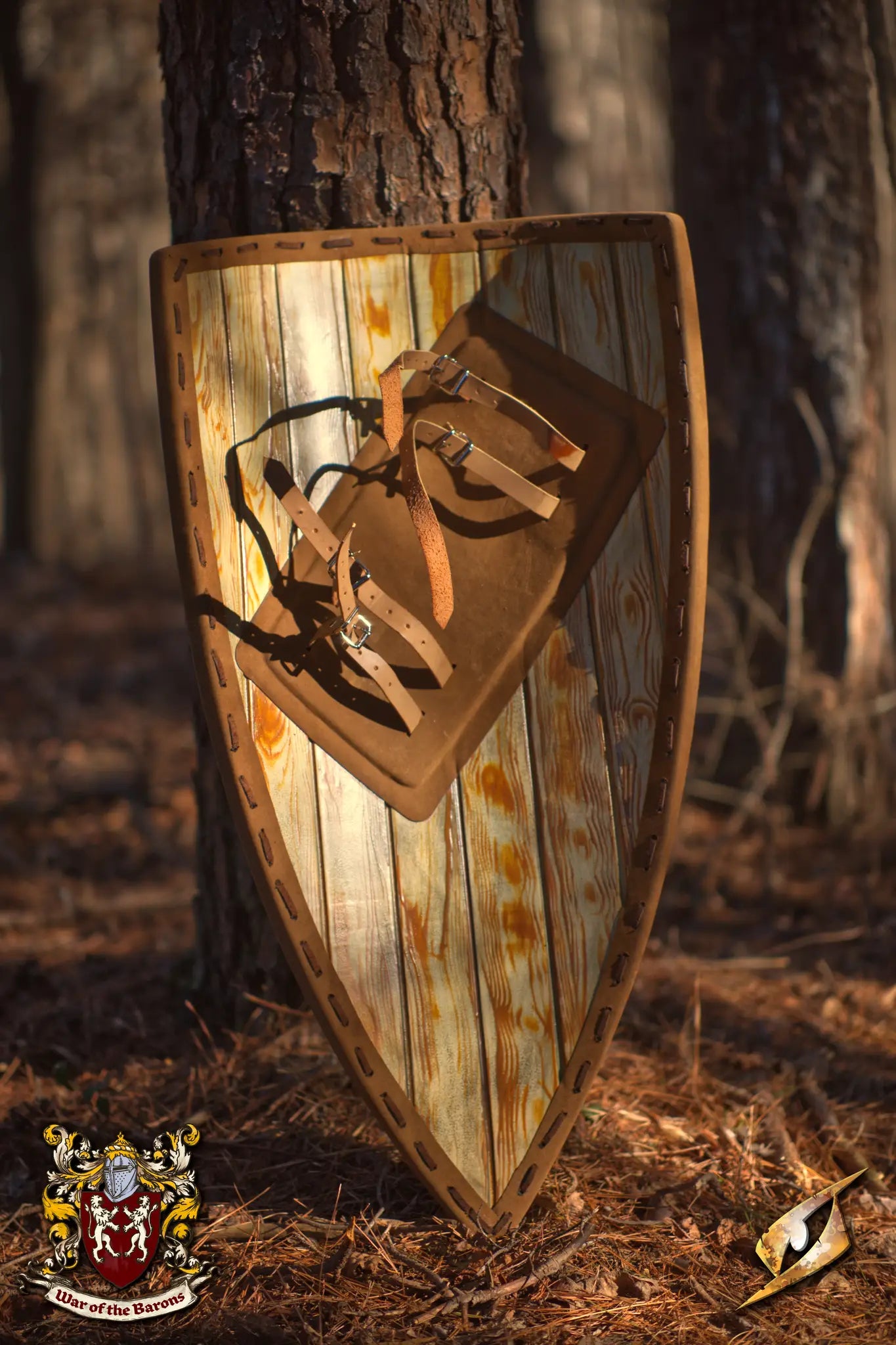 Baron's Shield resting against a tree, featuring a wooden design and leather straps for LARP events.