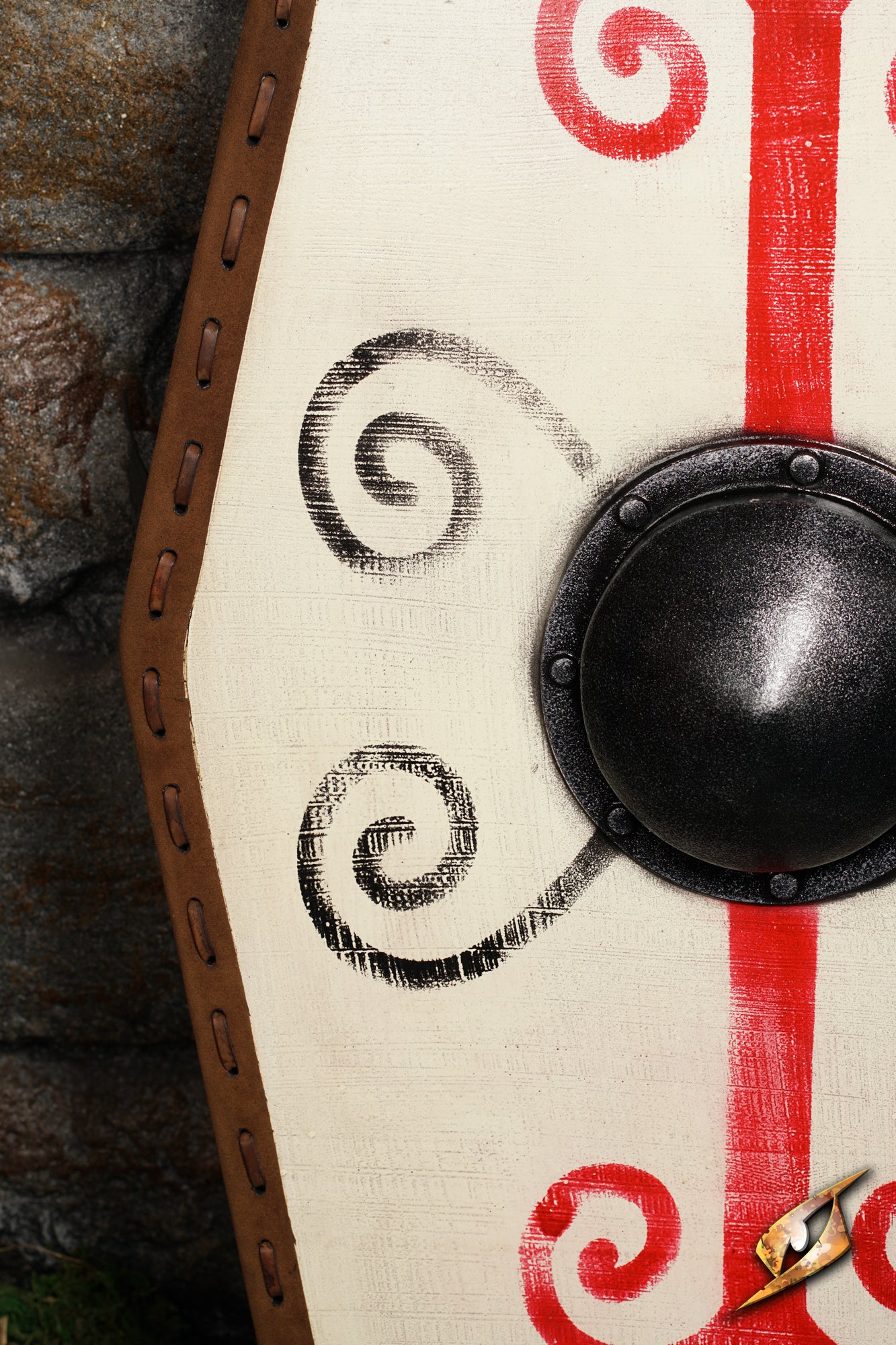 Close-up of the Germanic Shield showcasing intricate red and black tribal designs and a domed black boss.