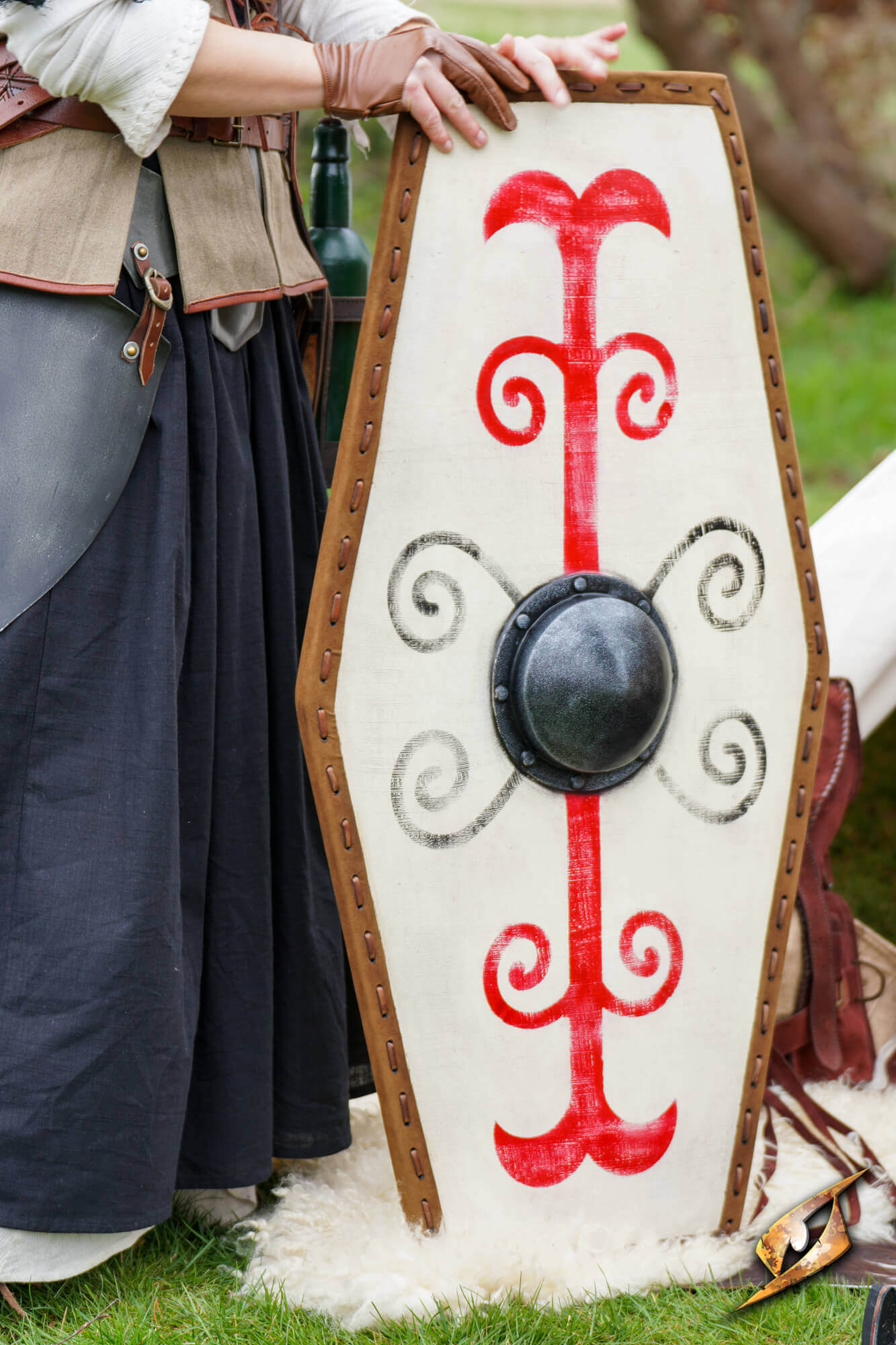 Germanic Shield featuring bold red tribal markings and a domed black boss, embodying ancient warrior aesthetics.