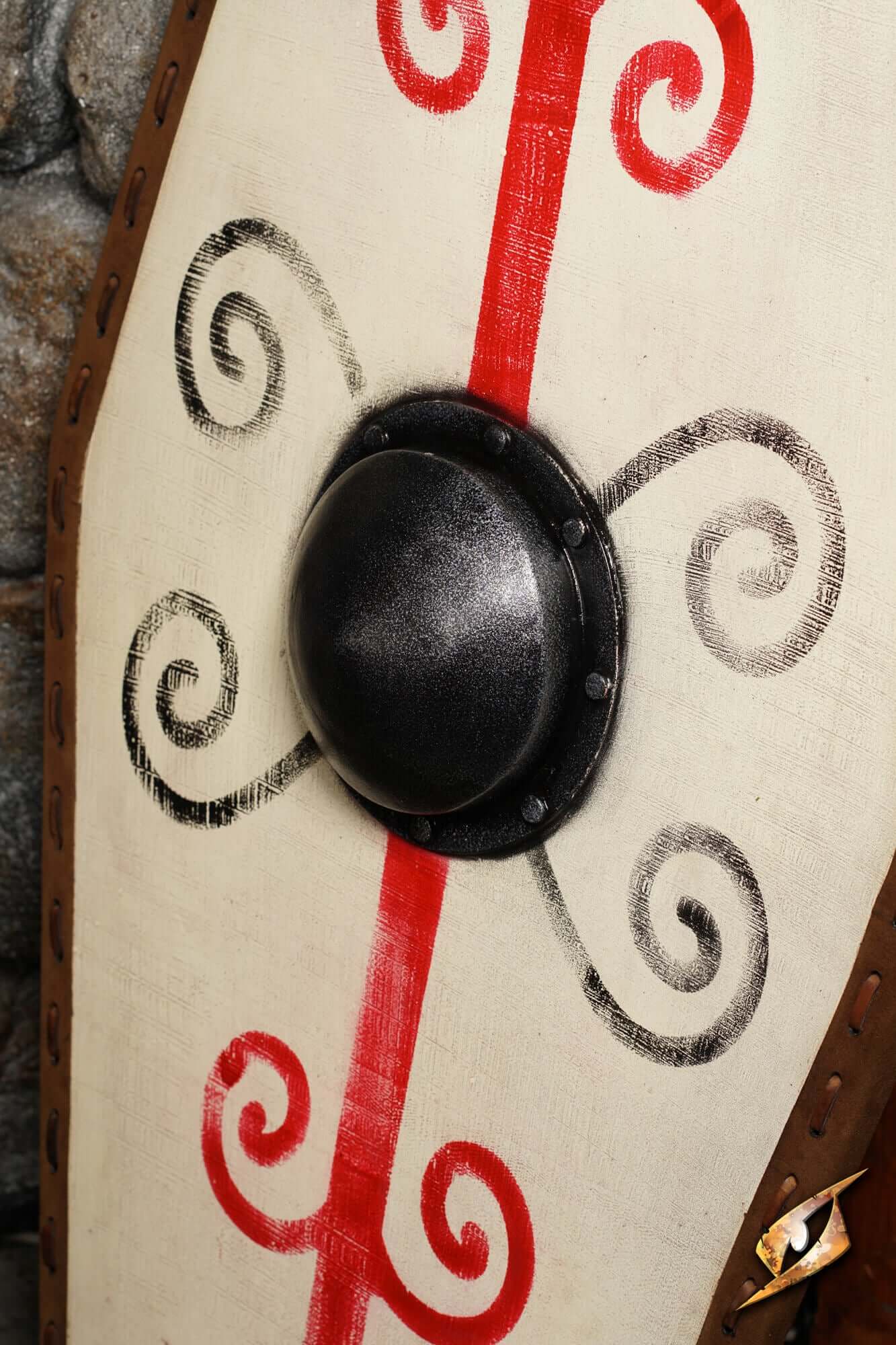 Germanic Shield with bold red tribal markings and a domed black boss, showcasing intricate grey scrollwork.