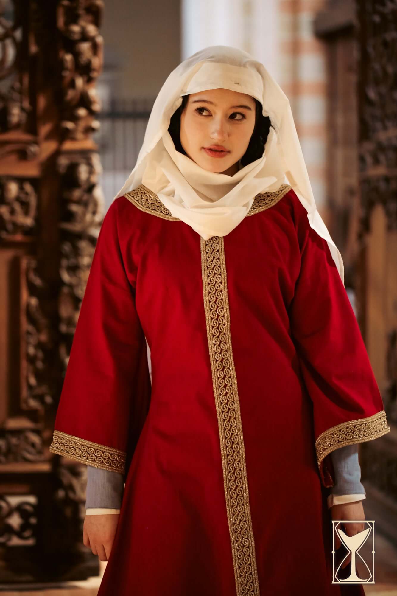 Overtunic Matilde in rich red color with elaborate woven trim and wide sleeves for a historical aesthetic.