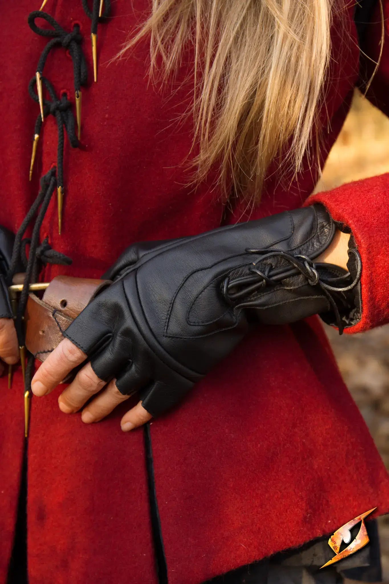 Elegant image of a person wearing black Thief Gloves with a red coat, showcasing style and functionality.
