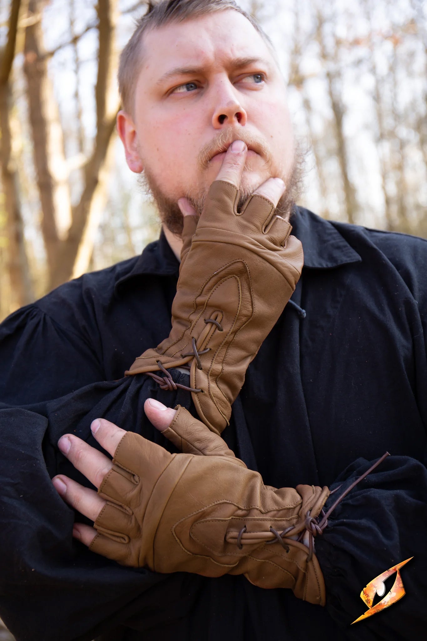 Man wearing Thief Gloves in an outdoor setting, emphasizing stealth and style with fingerless design.