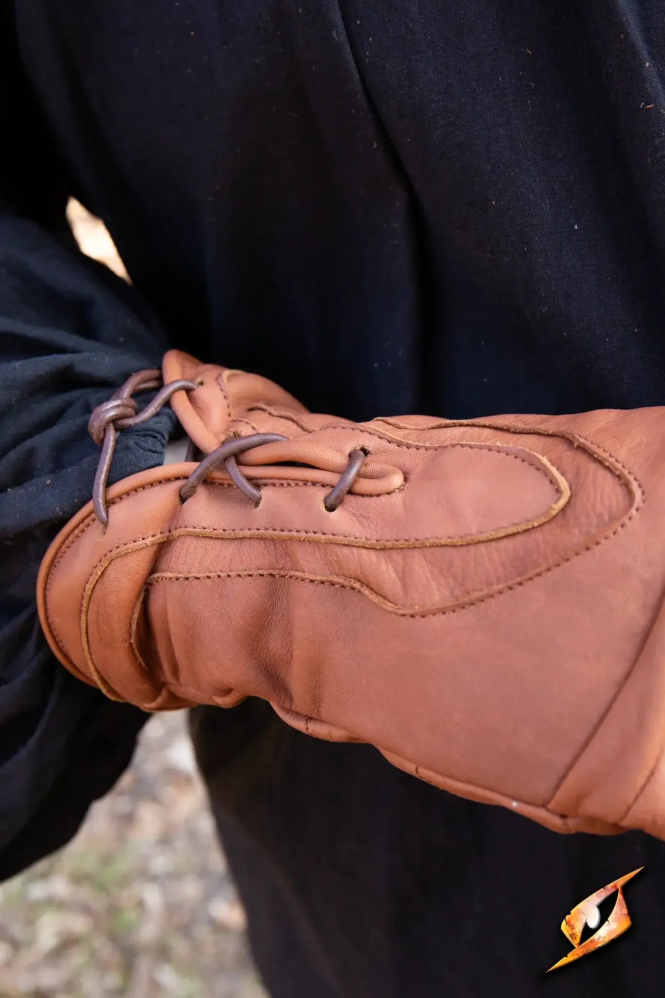 Close-up of brown leather Thief Gloves with lace detail, ideal for stealthy activities.