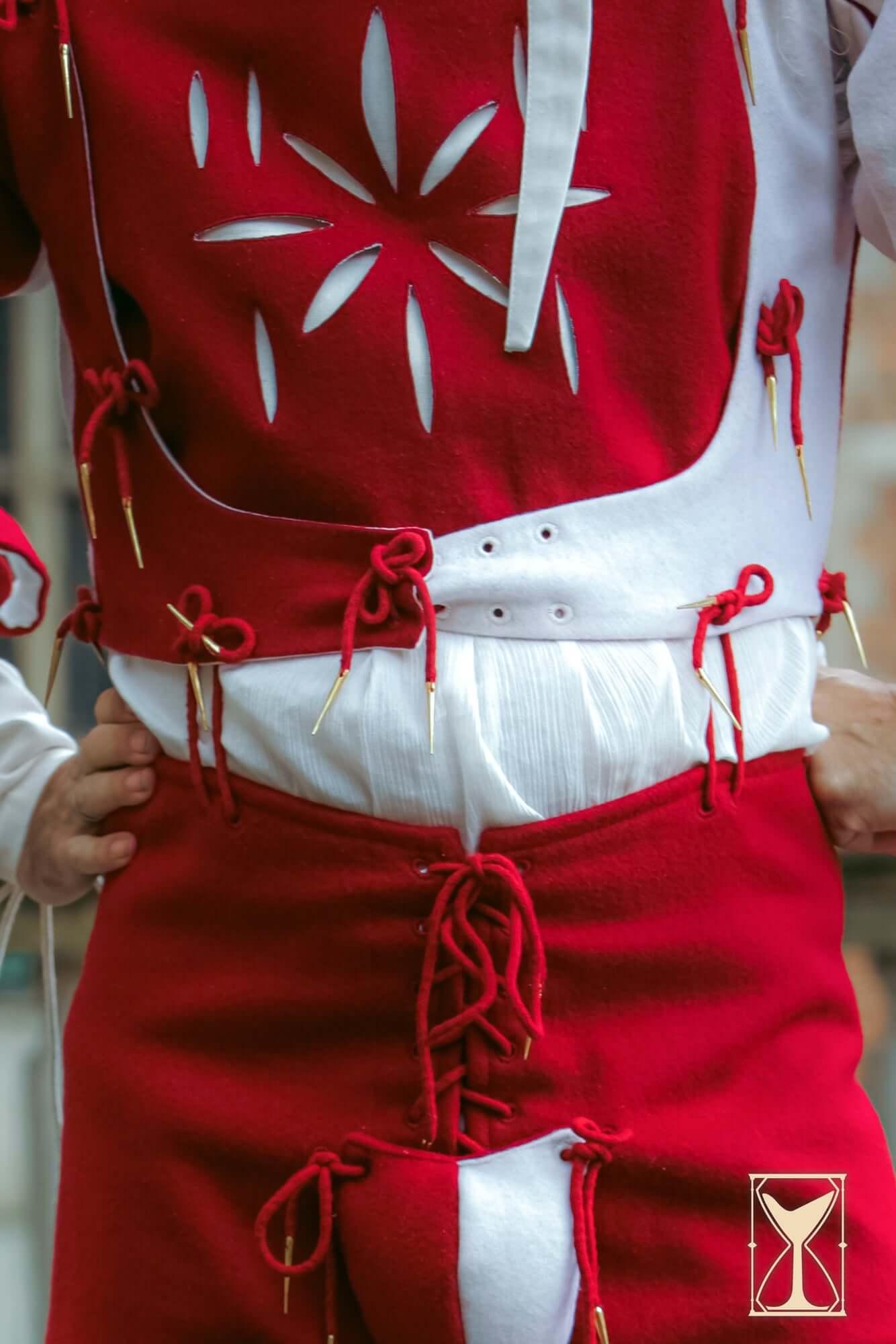 Landsknecht Doublet in red with detailed lacing and puff sleeves, showcasing historical costume style.