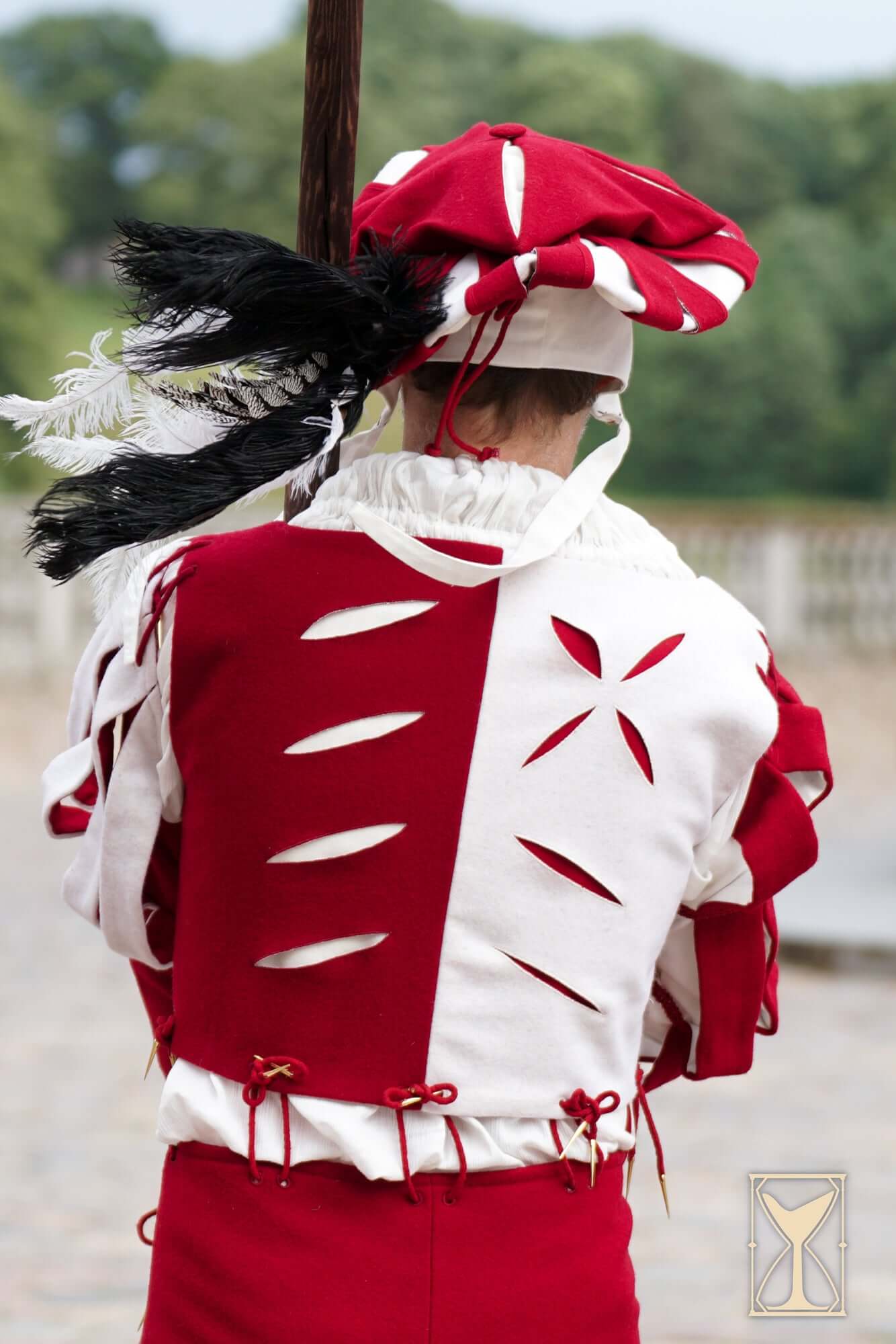 Landsknecht Doublet in red and white with puff and slash design, perfect for historical reenactments.