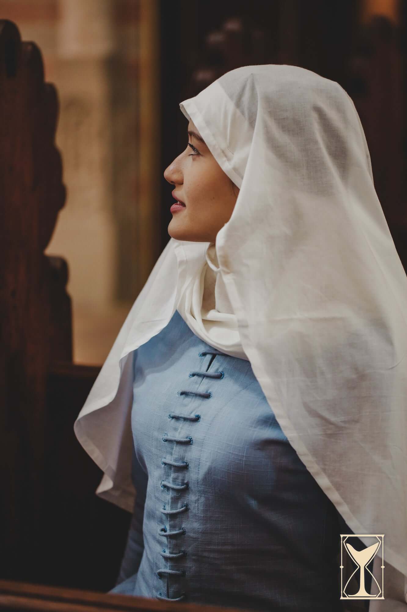 Cotehardie Marian shown on a model, featuring central lacing and a tailored silhouette, designed for medieval fashion.