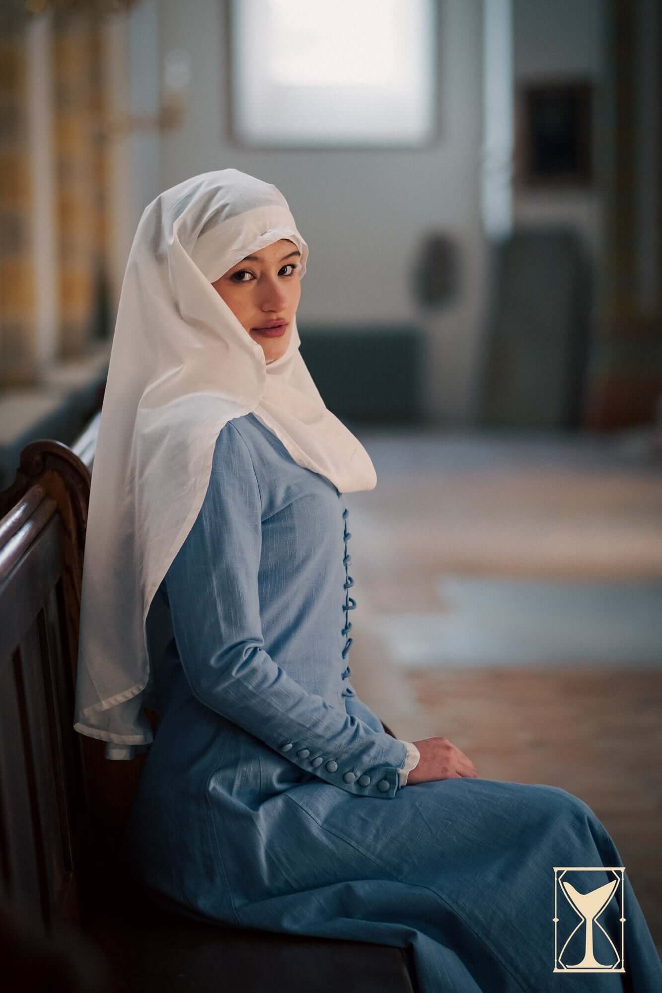 Cotehardie Marian dress styled with a white headscarf, showcasing the tailored medieval silhouette.