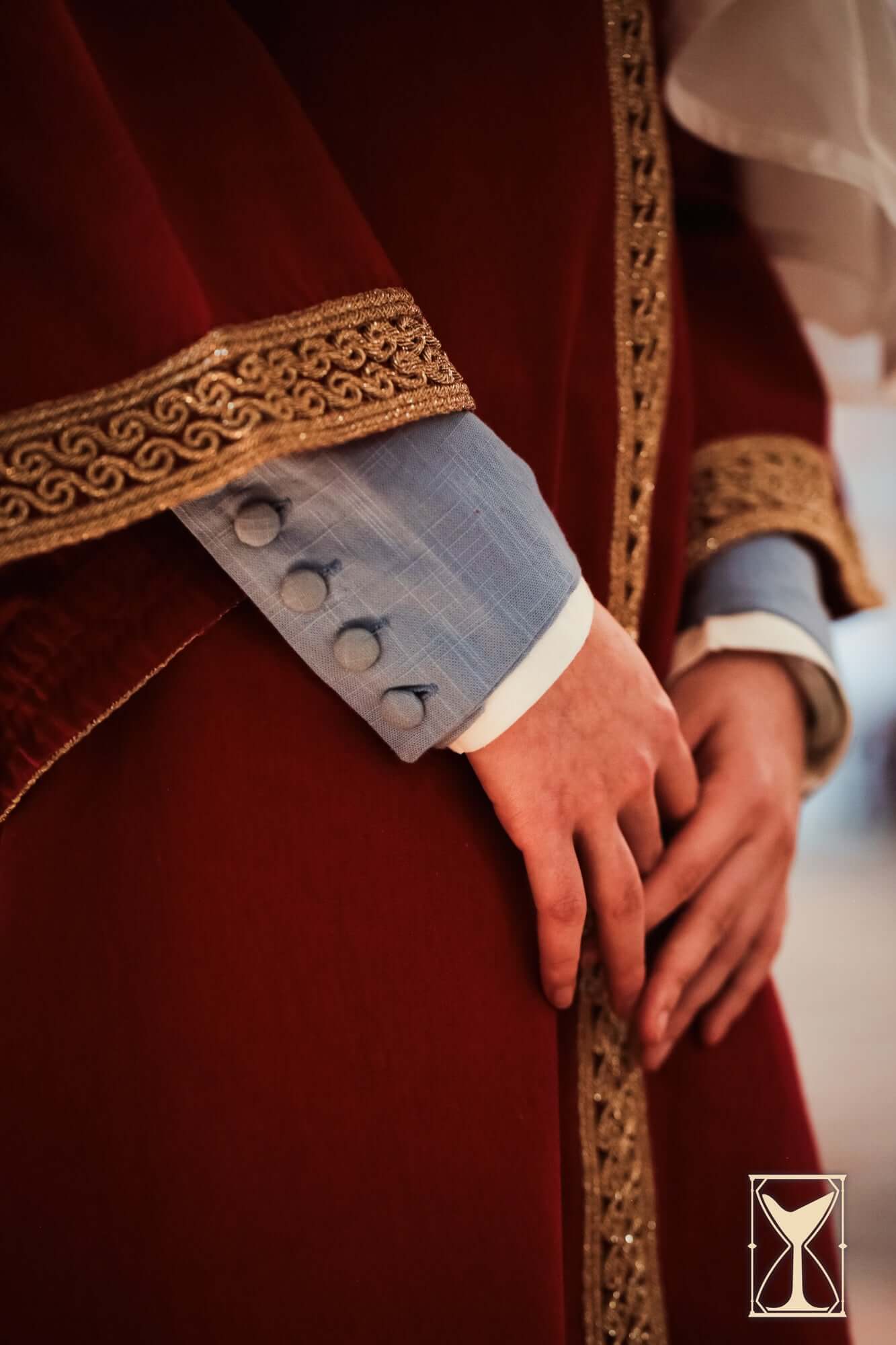 Cotehardie Marian dress detail featuring embellished sleeves and lacing system, showcasing medieval fashion elegance.