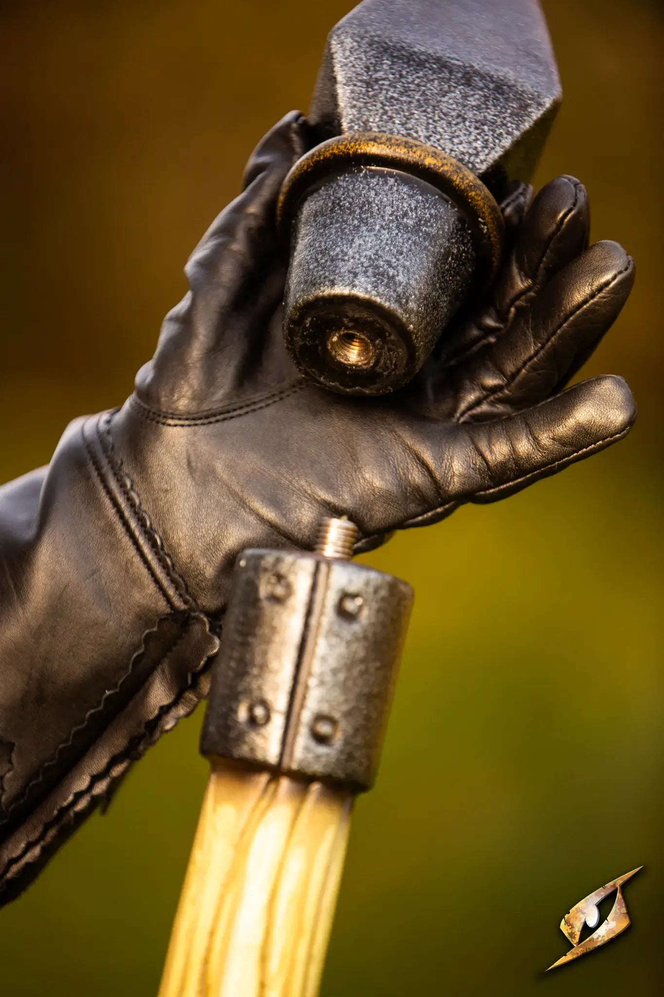 Close-up of hand holding Battle Standard - Spear Top, showcasing elegant spear-like design and custom features.