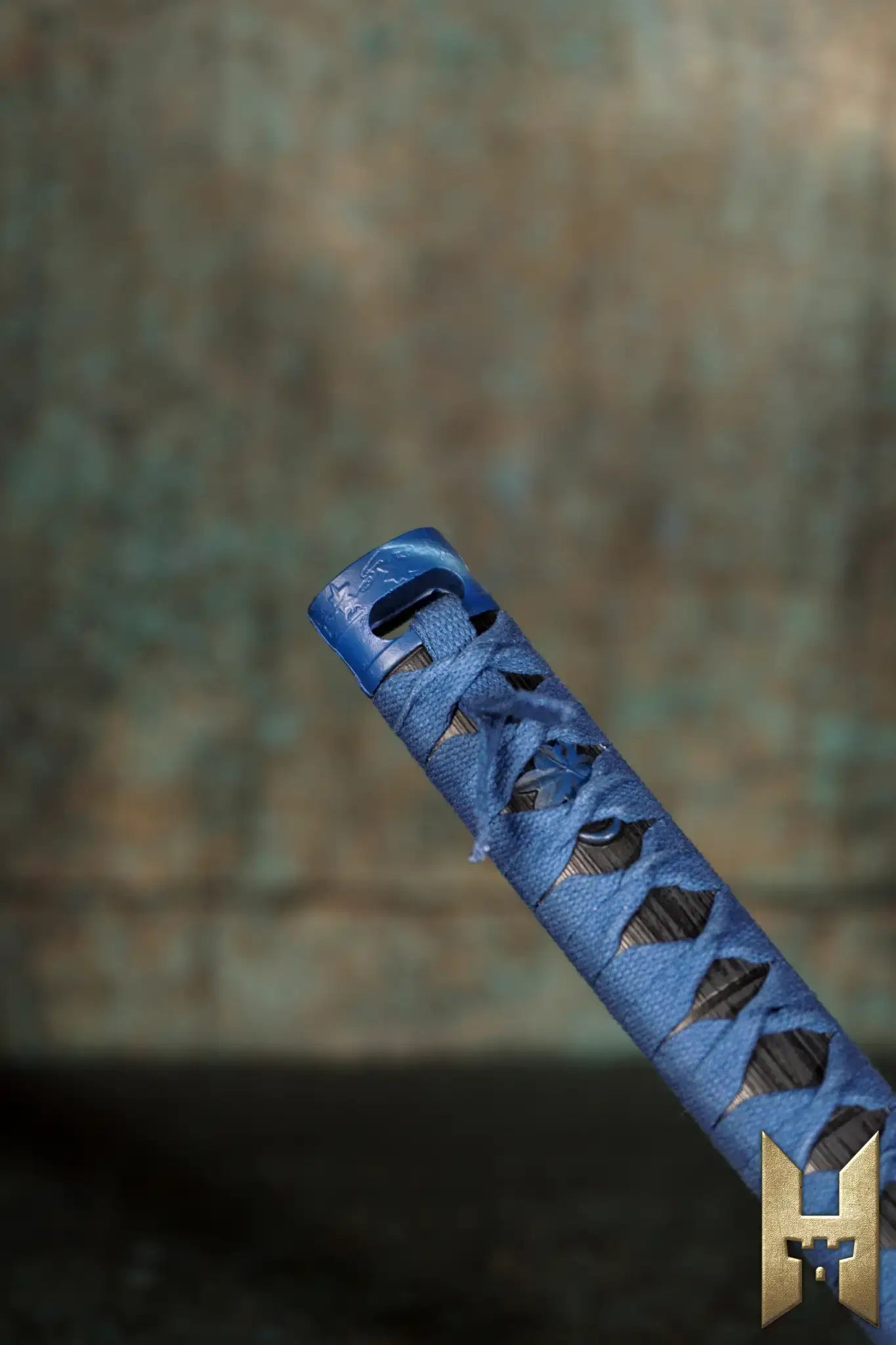 Ryūgan the Katana close-up view, featuring intricate blue hilt and traditional design elements.