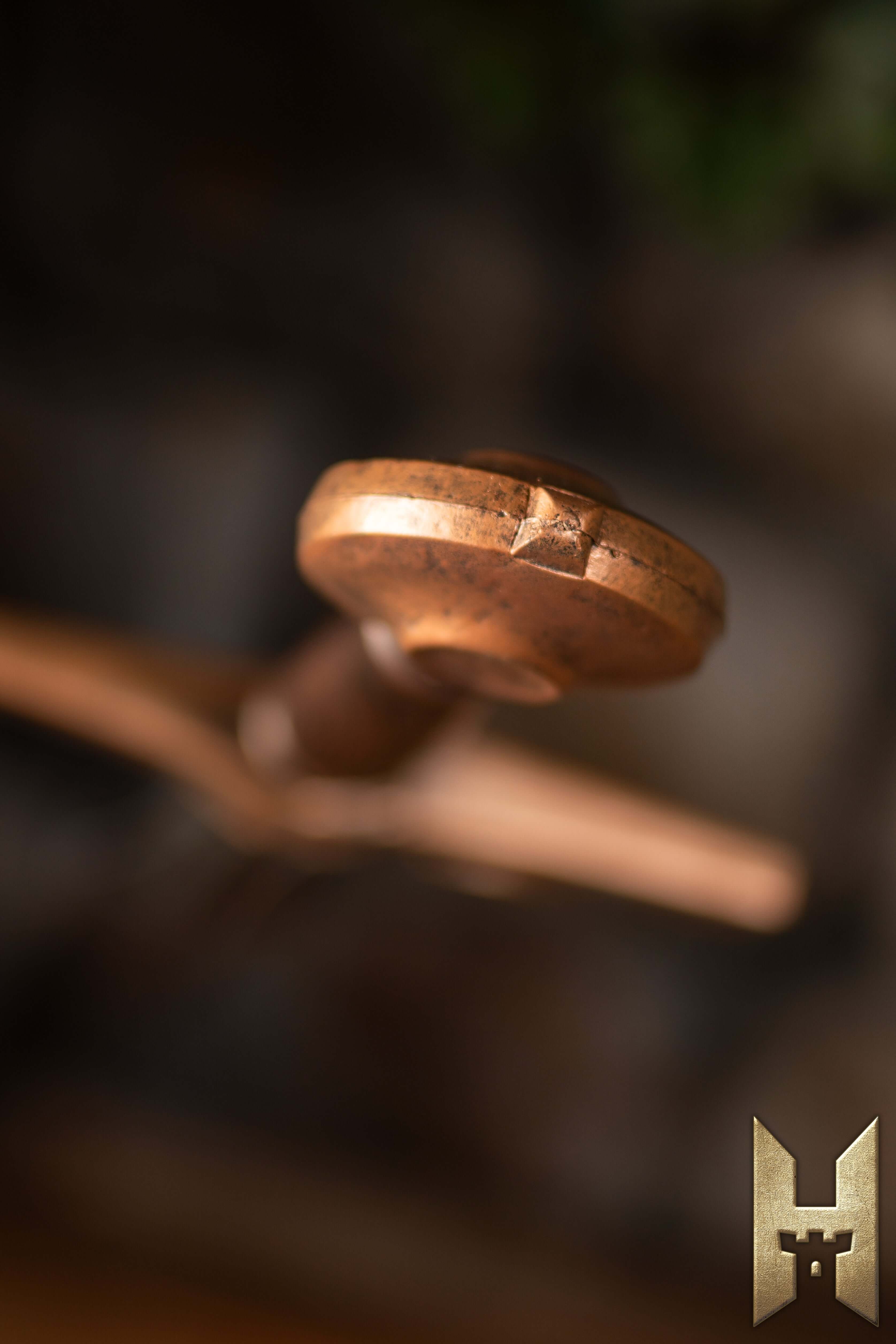 Close-up of the hilt of a Milanese Sword showcasing exquisite craftsmanship and detail.